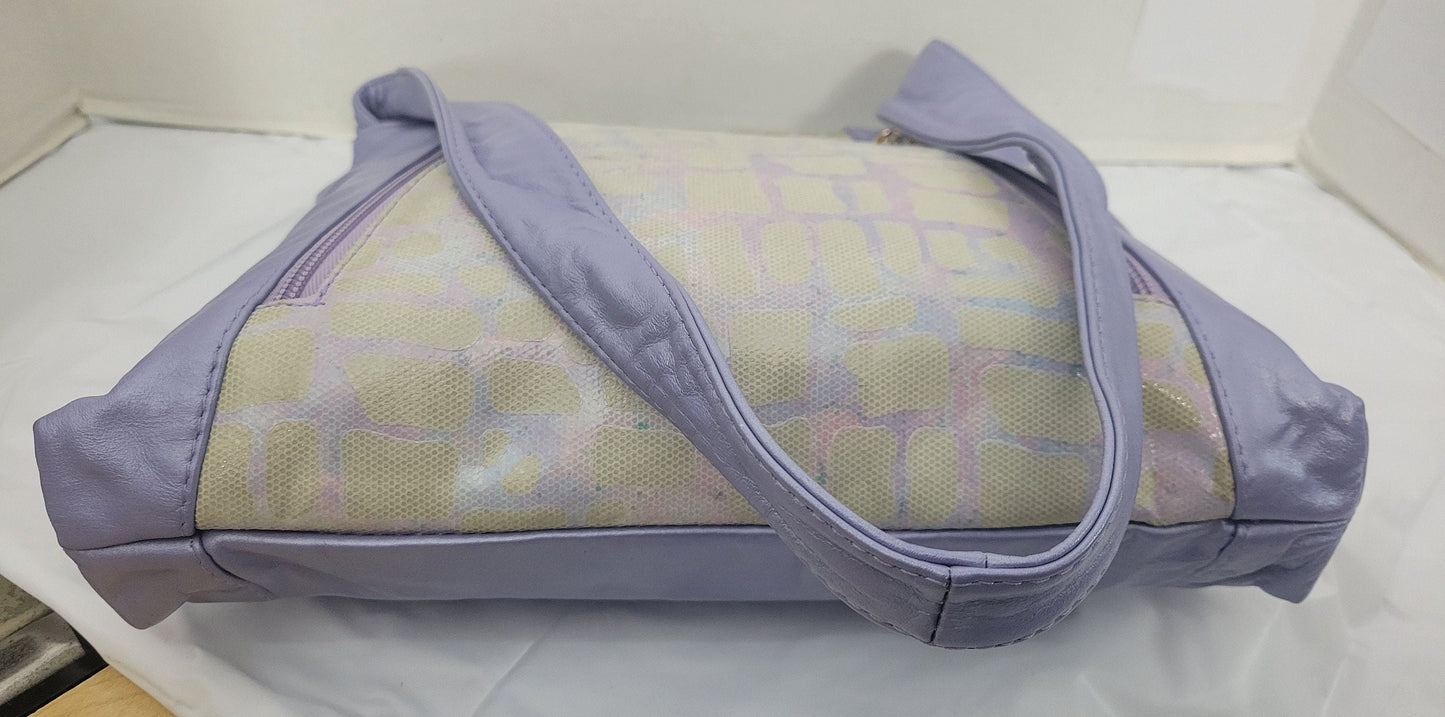 Purple with purple Two tone print leather handbag! Two left and right pockets. Made in USA.