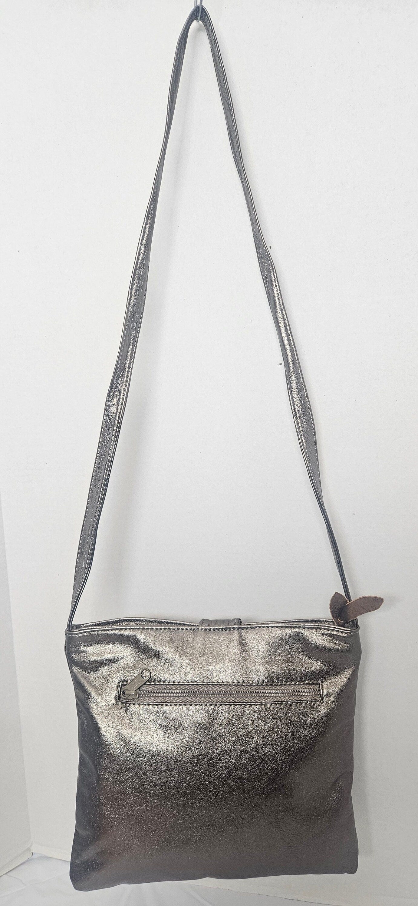 Shinning Pewter with Gold matel Rings Genuine Leather Handbag for all. Tejrasila-Ring Purse. Made in USA. Design for you.