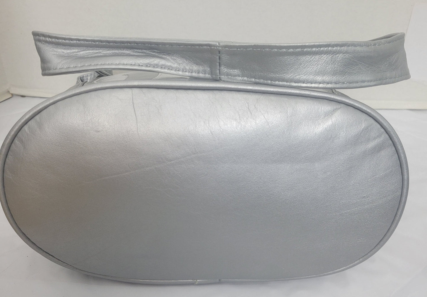 Tejrasila-Silver Grey with silver shining leather handbag!Zigzag designe. 3 outside pockets.Made in USA!