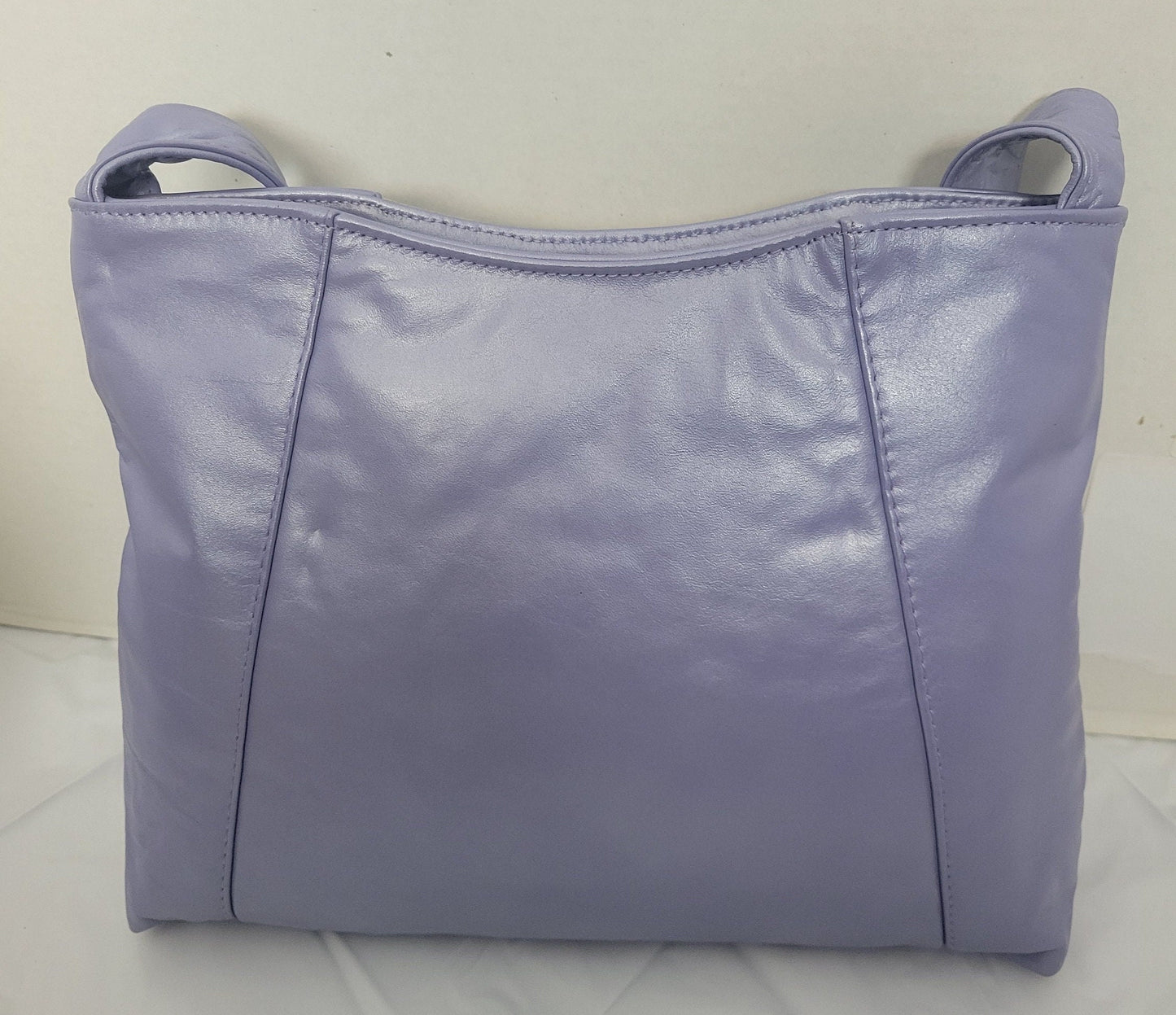 Purple with purple Two tone print leather handbag! Two left and right pockets. Made in USA.