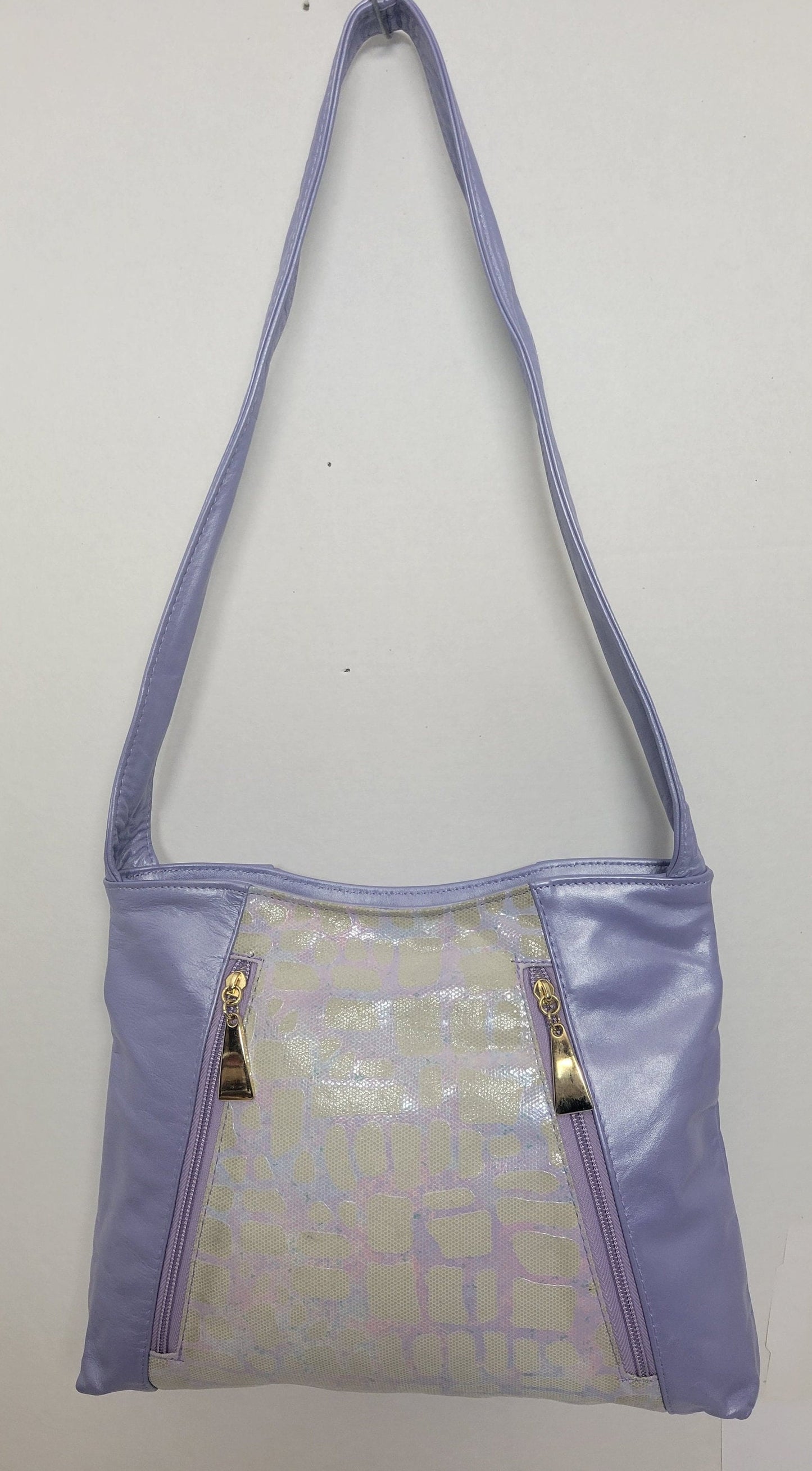 Purple with purple Two tone print leather handbag! Two left and right pockets. Made in USA.