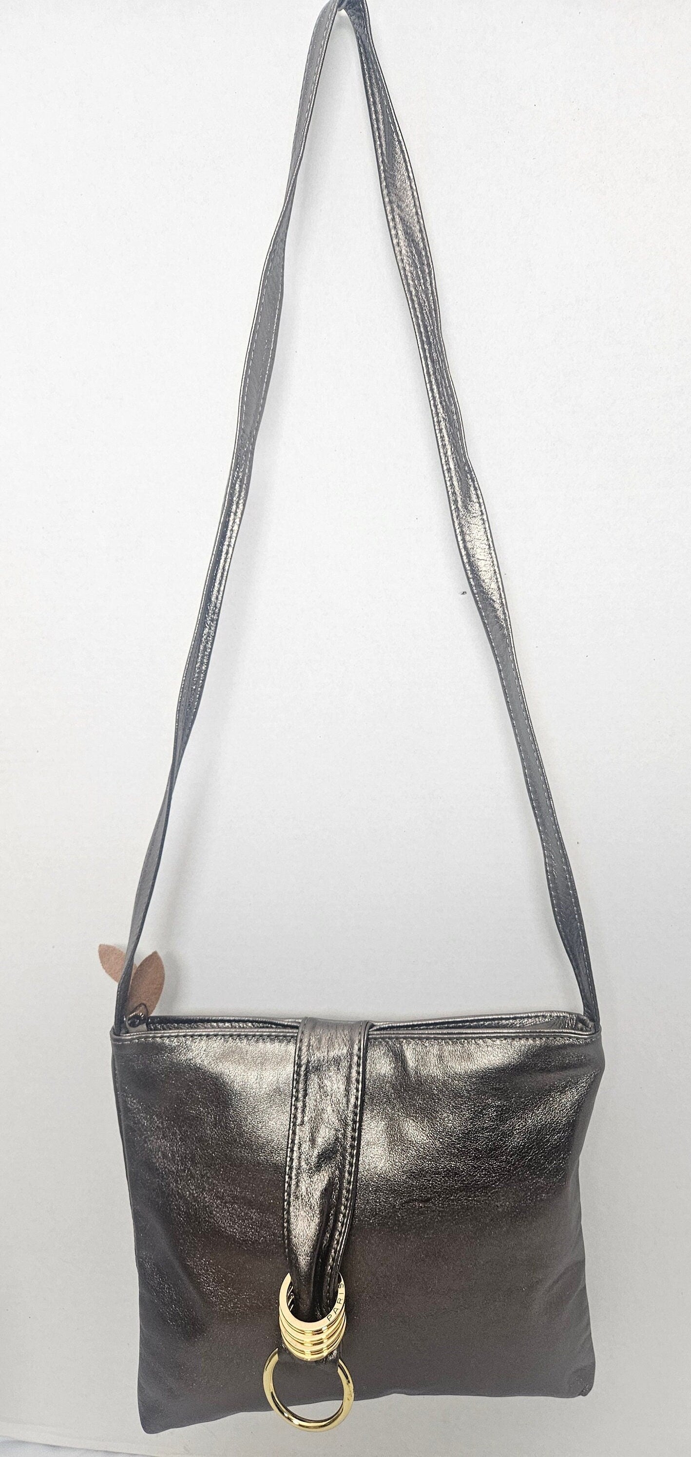 Shinning Pewter with Gold matel Rings Genuine Leather Handbag for all. Tejrasila-Ring Purse. Made in USA. Design for you.