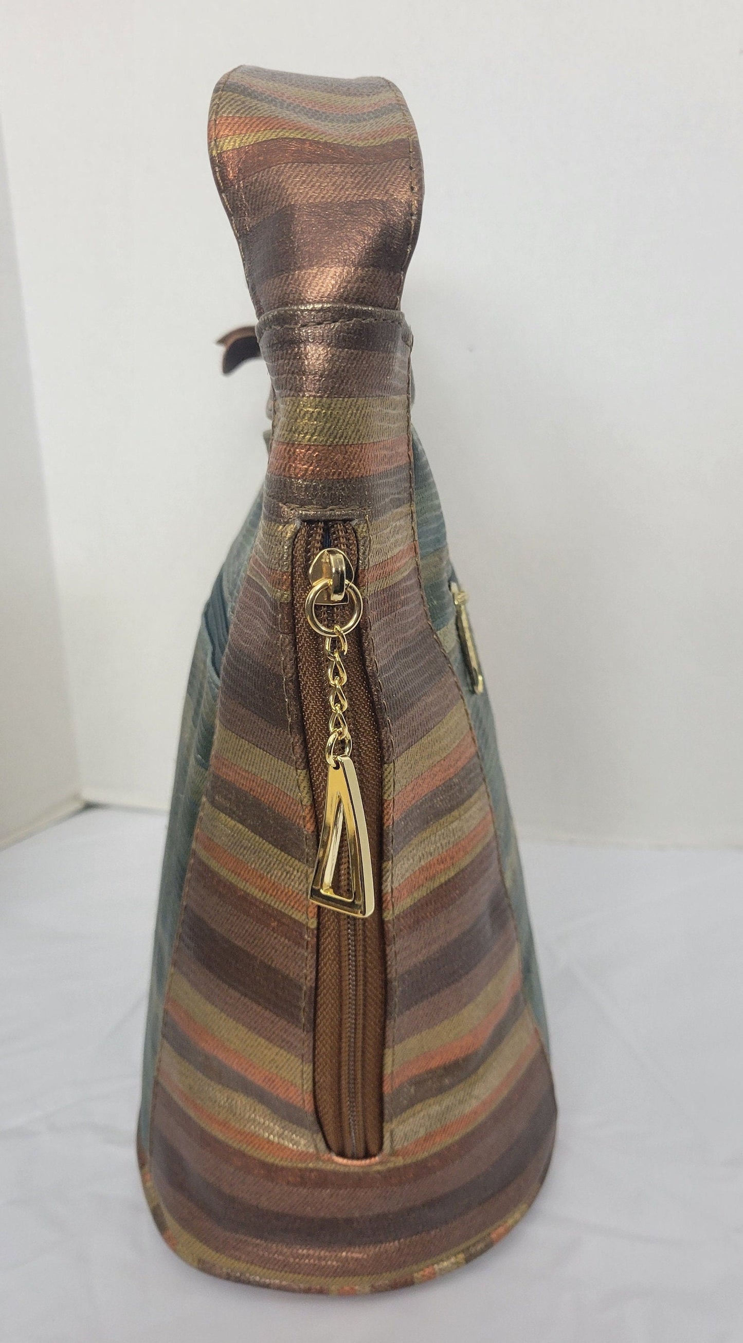 Tejrasila-Bronx multi with green multi print women's Shoulder handbag! Three outside pockets.Made with genuine leather in USA!