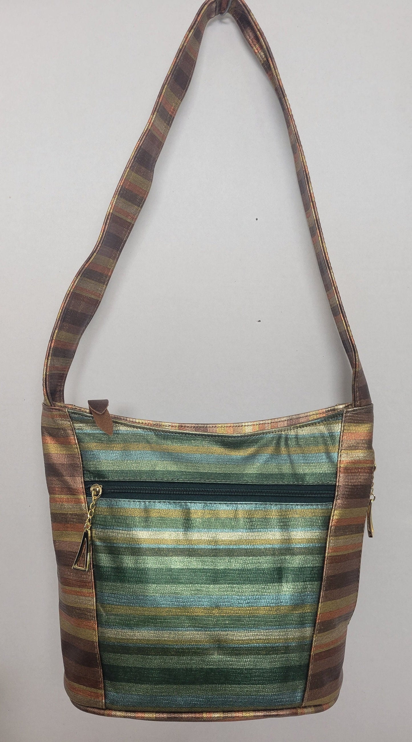 Tejrasila-Bronx multi with green multi print women's Shoulder handbag! Three outside pockets.Made with genuine leather in USA!