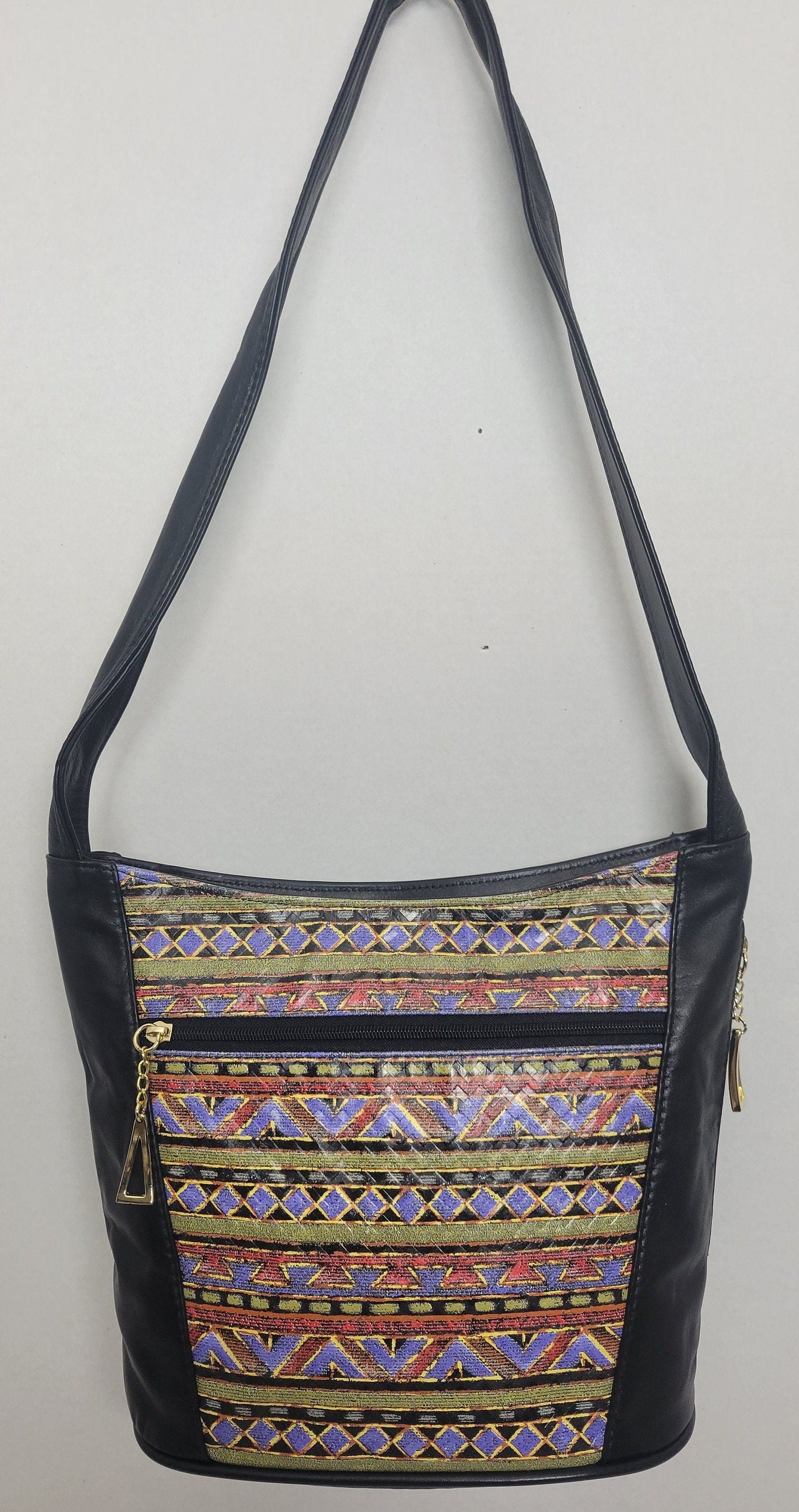 Tejrasila-Black with multi print genuine leather Shoulder handbag! Three outside pockets.Made in USA!