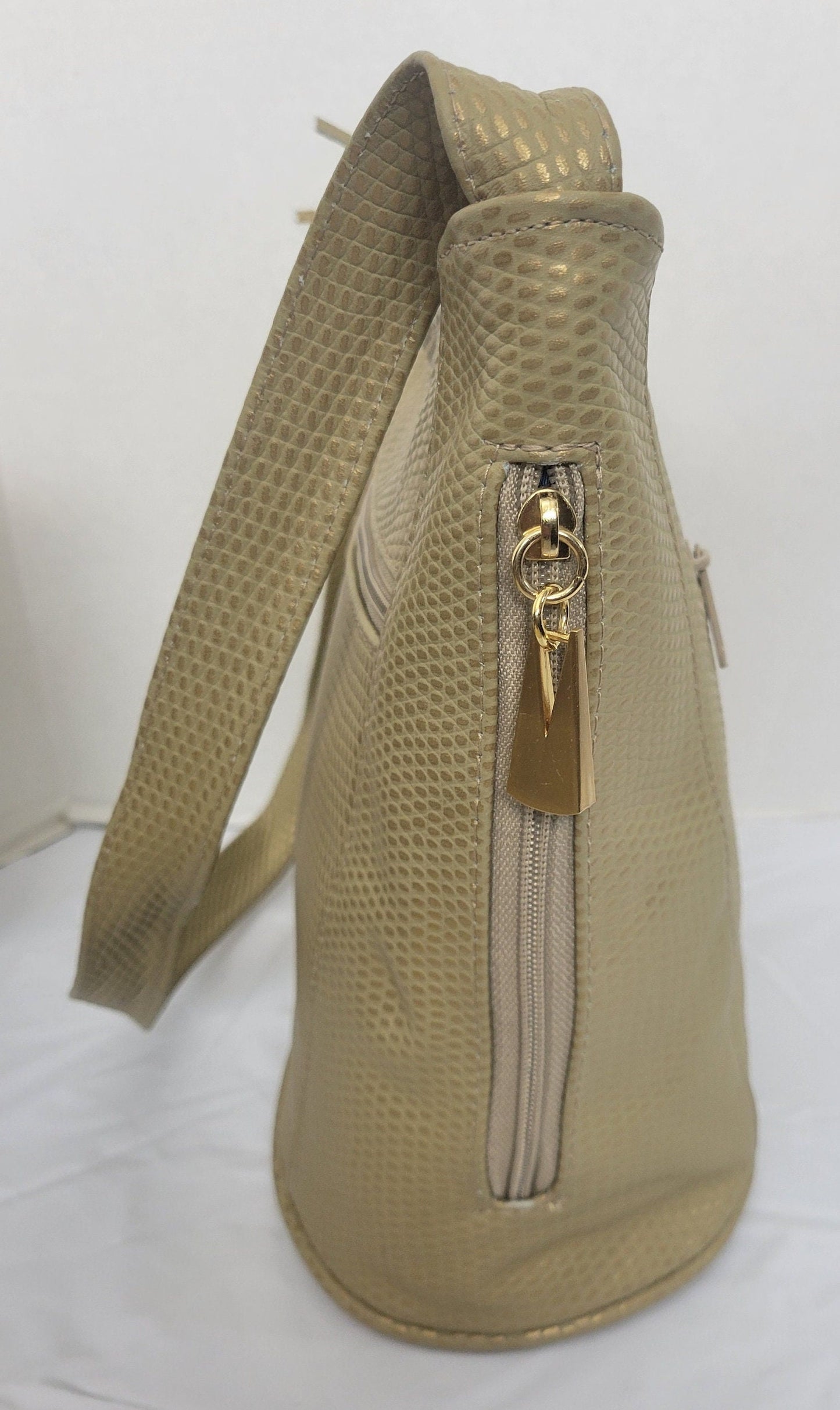 Tejrasila- Champagne print women's Shoulder handbag! Three outside pockets.Made with genuine leather in USA!