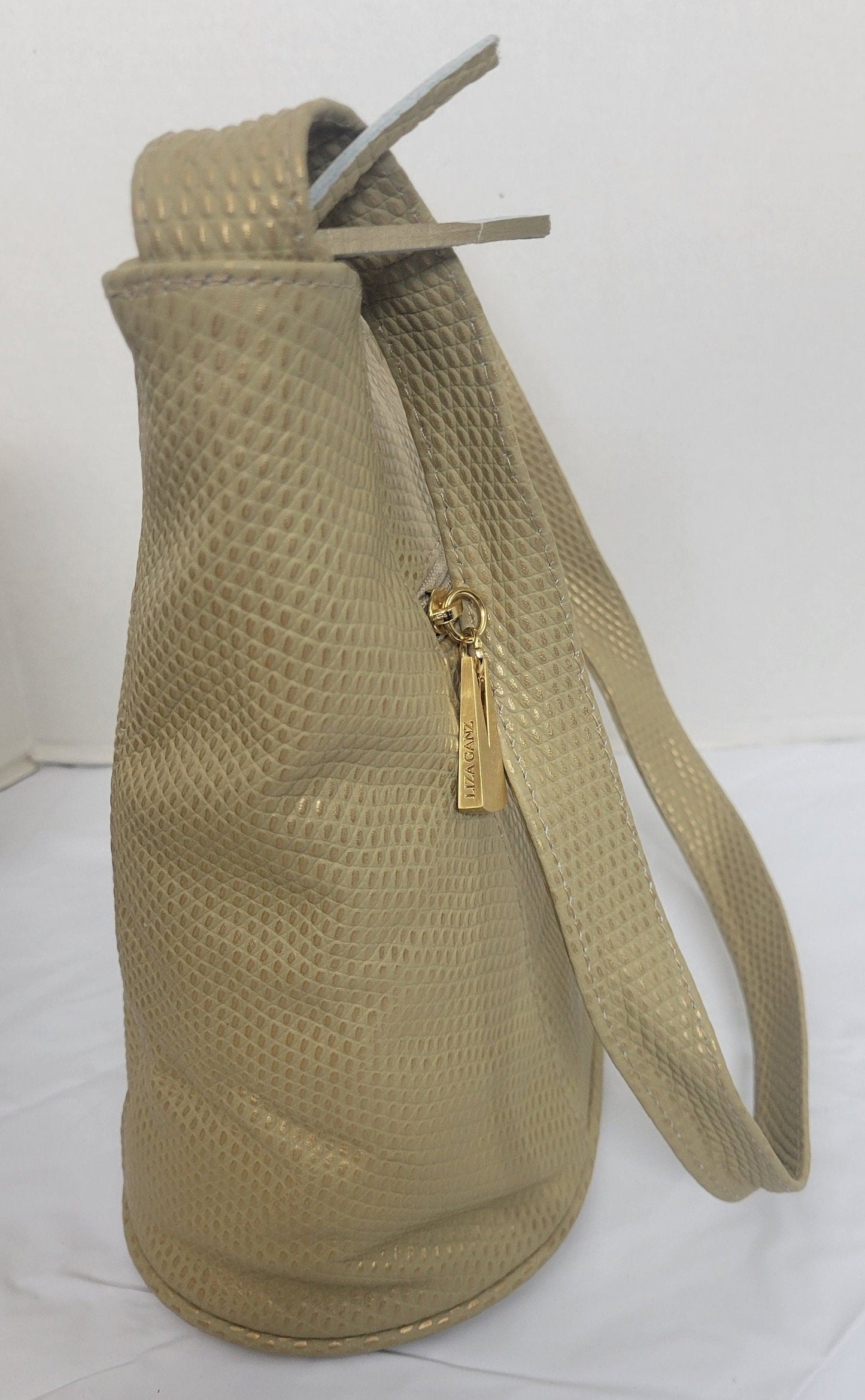 Tejrasila- Champagne print women's Shoulder handbag! Three outside pockets.Made with genuine leather in USA!