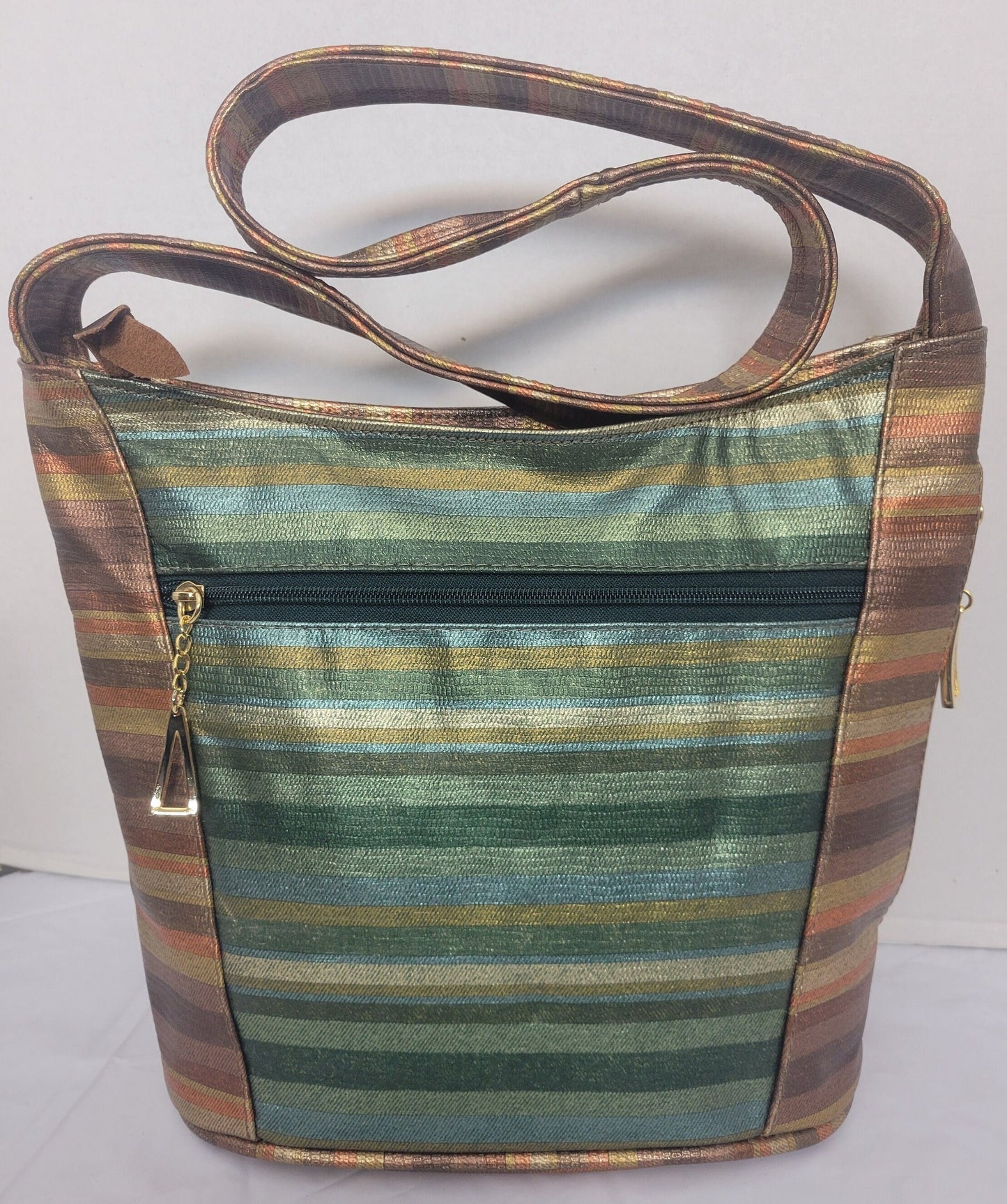 Tejrasila-Bronx multi with green multi print women's Shoulder handbag! Three outside pockets.Made with genuine leather in USA!