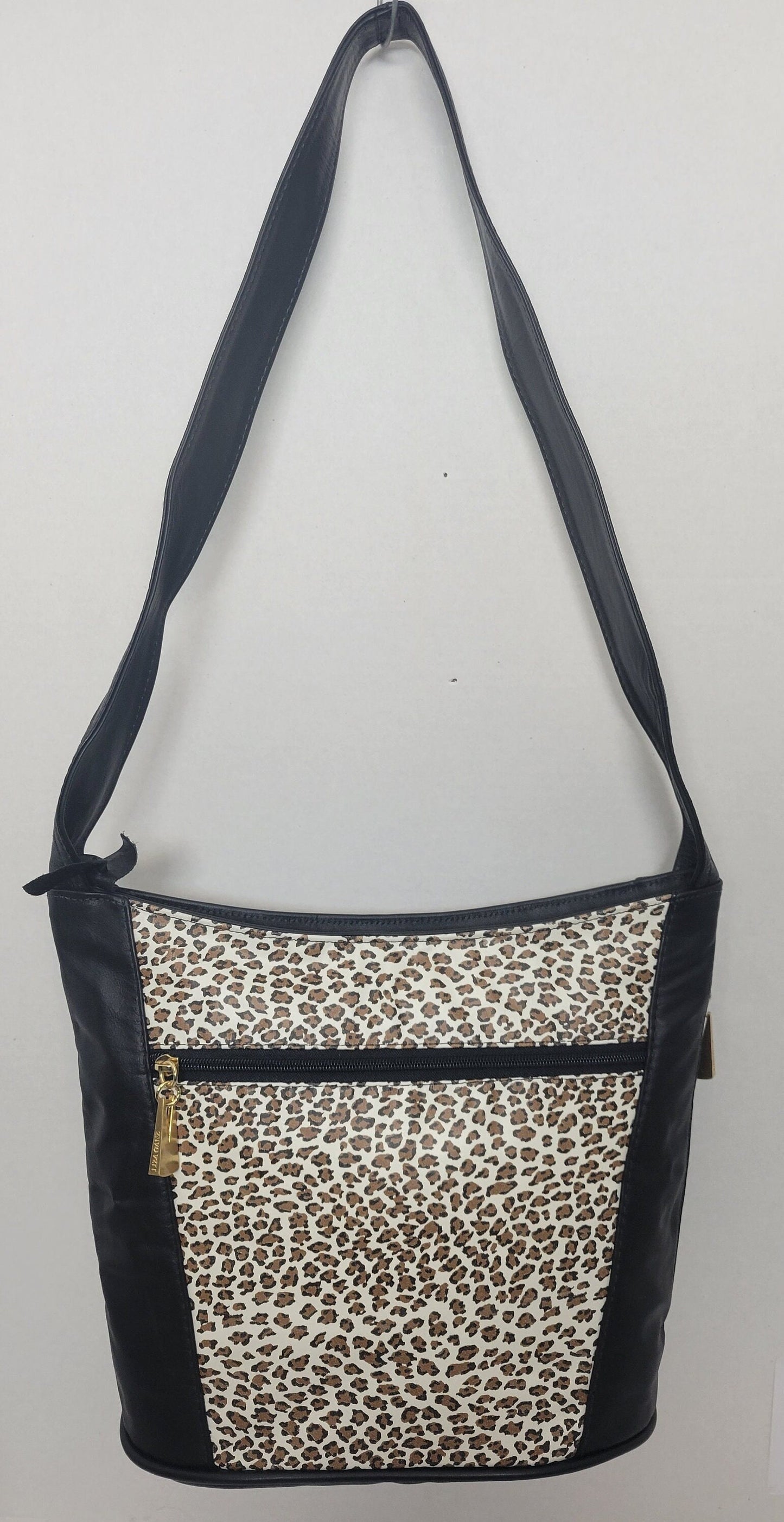 Tejrasila-Black with tiger print genuine leather Shoulder handbag! Three outside pockets.Made in USA!