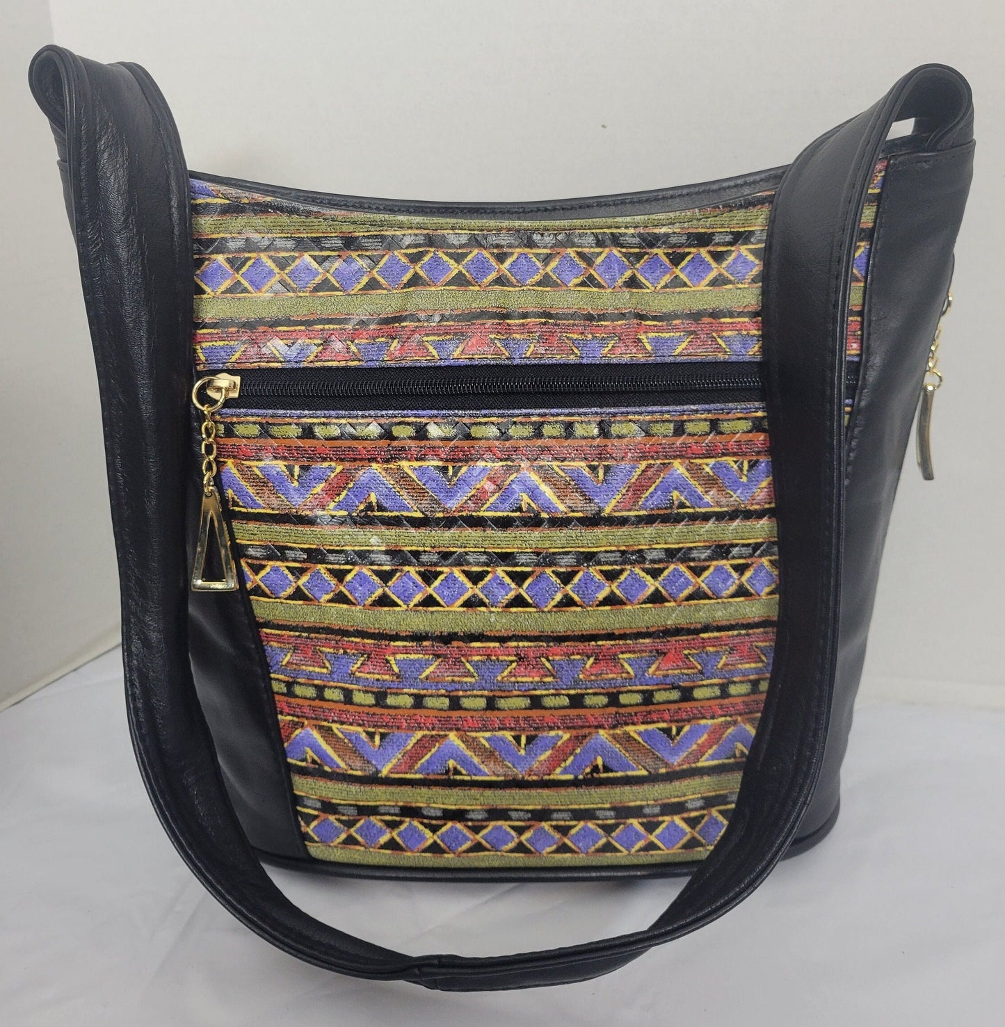 Tejrasila-Black with multi print genuine leather Shoulder handbag! Three outside pockets.Made in USA!