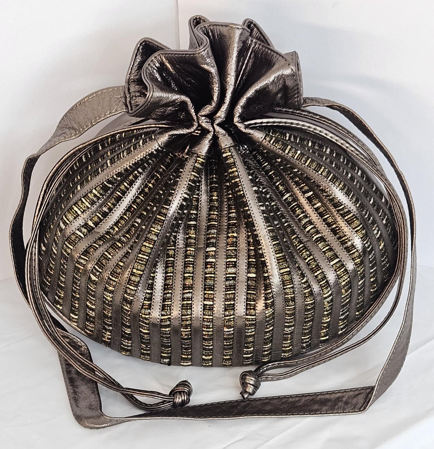 Pewter shinning Genuine Leather with fabric zigzags stripes design. Item TR2031Ps-zig.Close with Drowsting Shoulders.Made in USA.