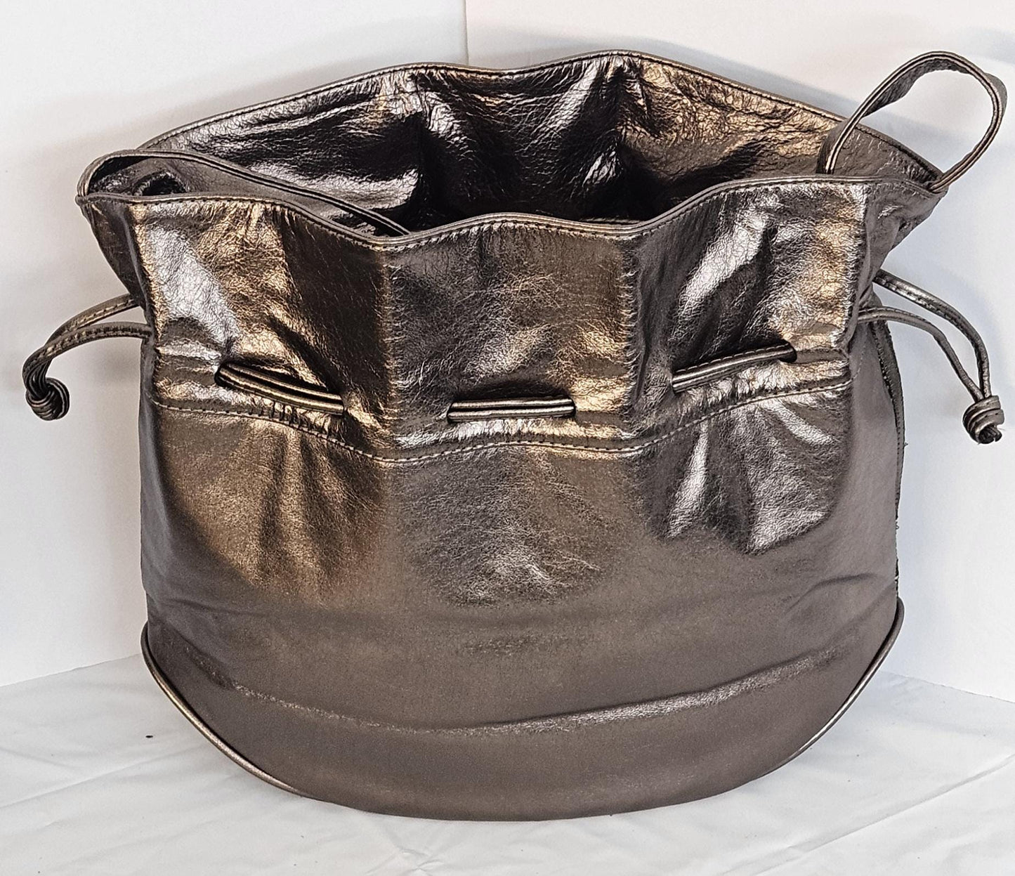 Pewter shinning Genuine Leather with fabric zigzags stripes design. Item TR2031Ps-zig.Close with Drowsting Shoulders.Made in USA.