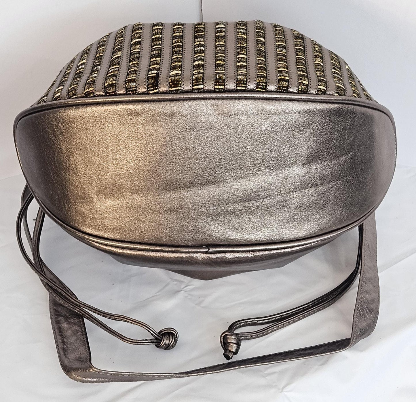 Pewter shinning Genuine Leather with fabric zigzags stripes design. Item TR2031Ps-zig.Close with Drowsting Shoulders.Made in USA.