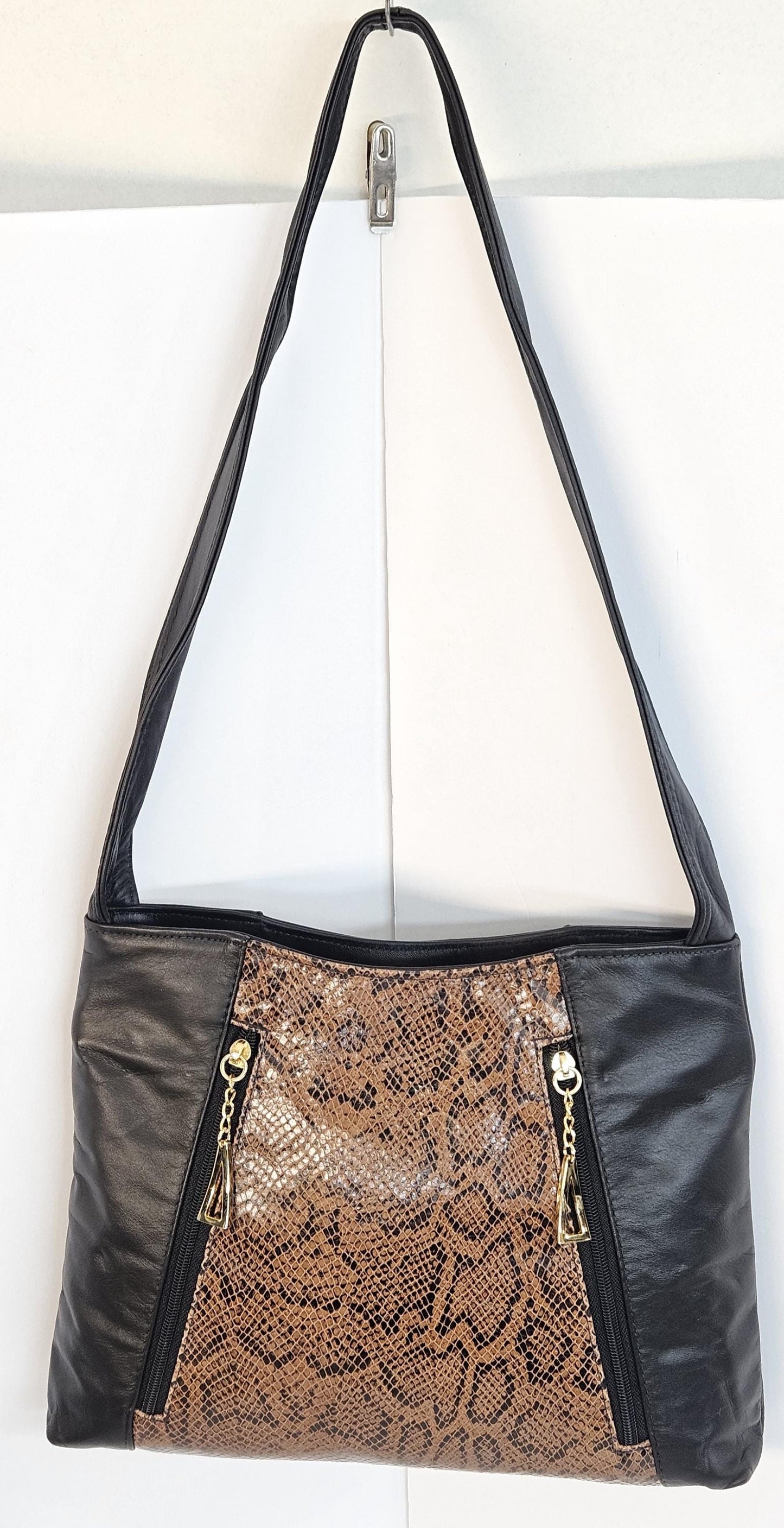Black with black Brown print leather handbag! Two left and right pockets. TR9044Bbrp Made in USA.