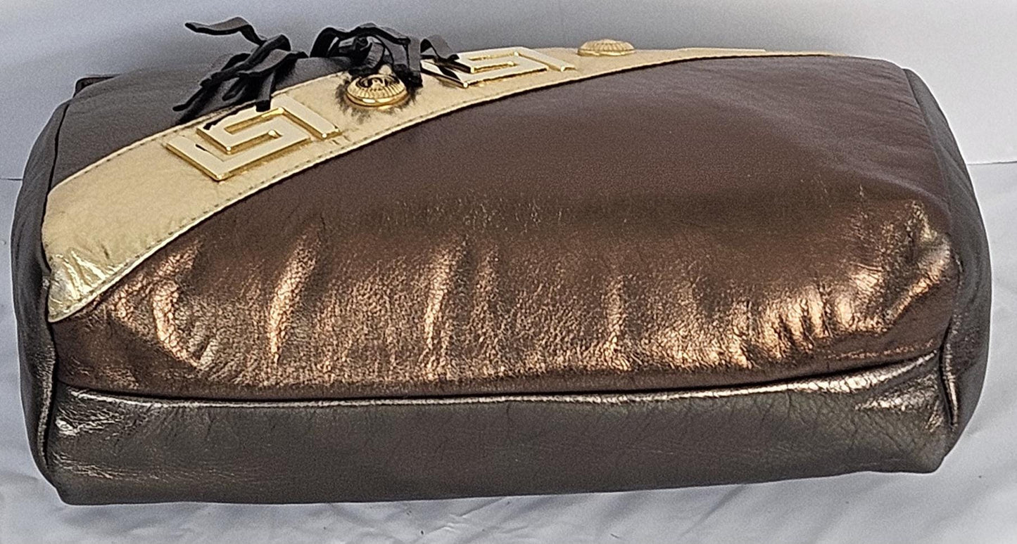 Pewter,bronze,and gold metallic design with gold matel Z&buttons. Genuine Leather Handbag #TR3018PBG-gzb-1.Made in USA.