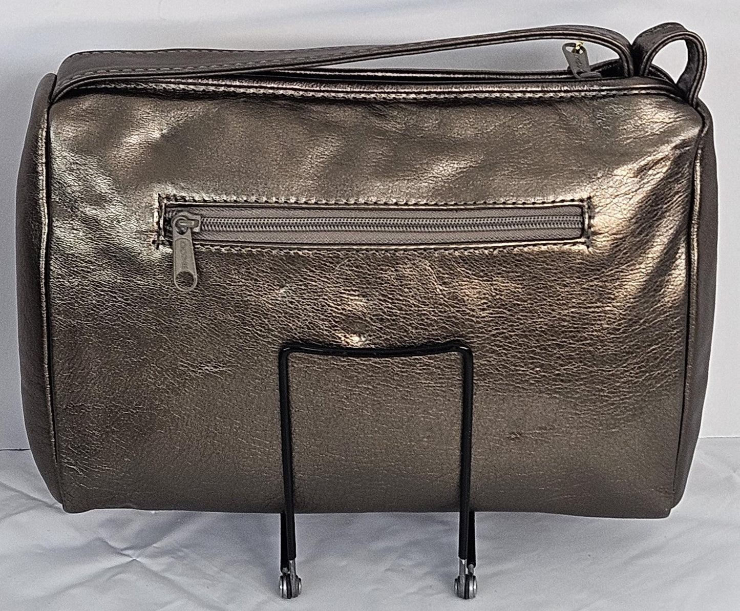 Pewter,bronze,and gold metallic design with gold matel Z&buttons. Genuine Leather Handbag #TR3018PBG-gzb-1.Made in USA.
