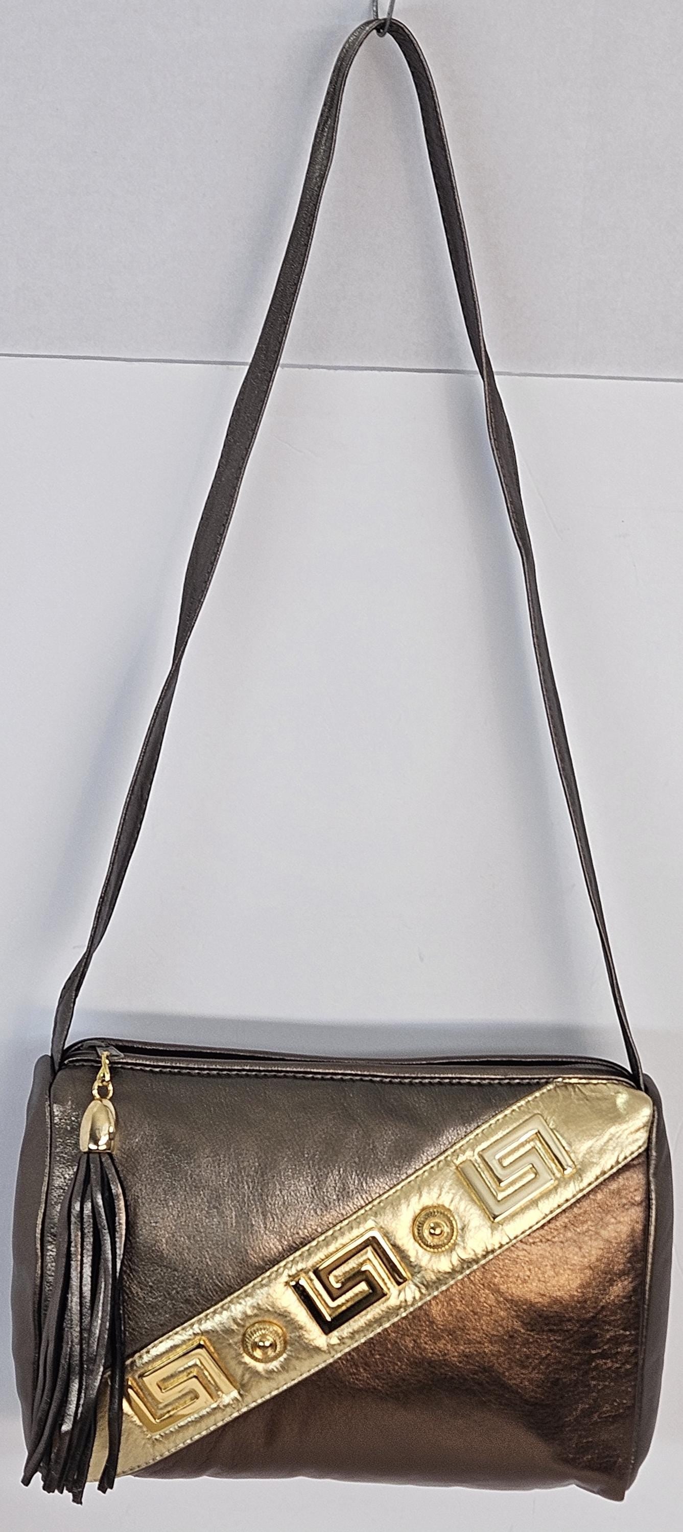 Pewter,bronze,and gold metallic design with gold matel Z&buttons. Genuine Leather Handbag #TR3018PBG-gzb-1.Made in USA.