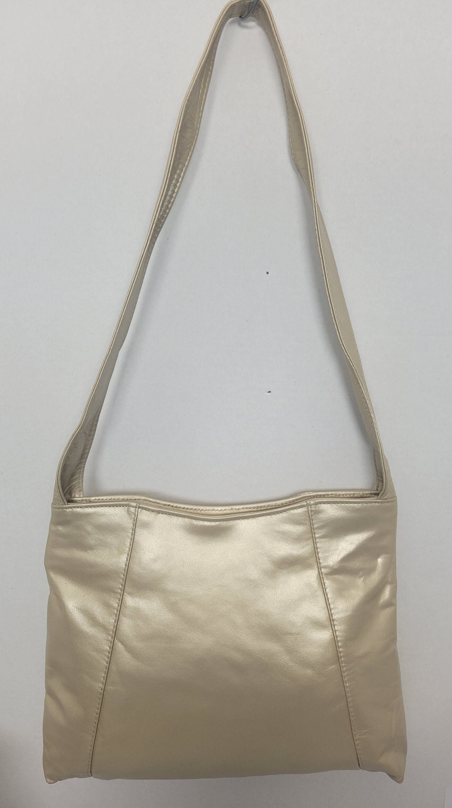 Champagne with Champagne print leather handbag! Two left and right pockets. Made in USA.