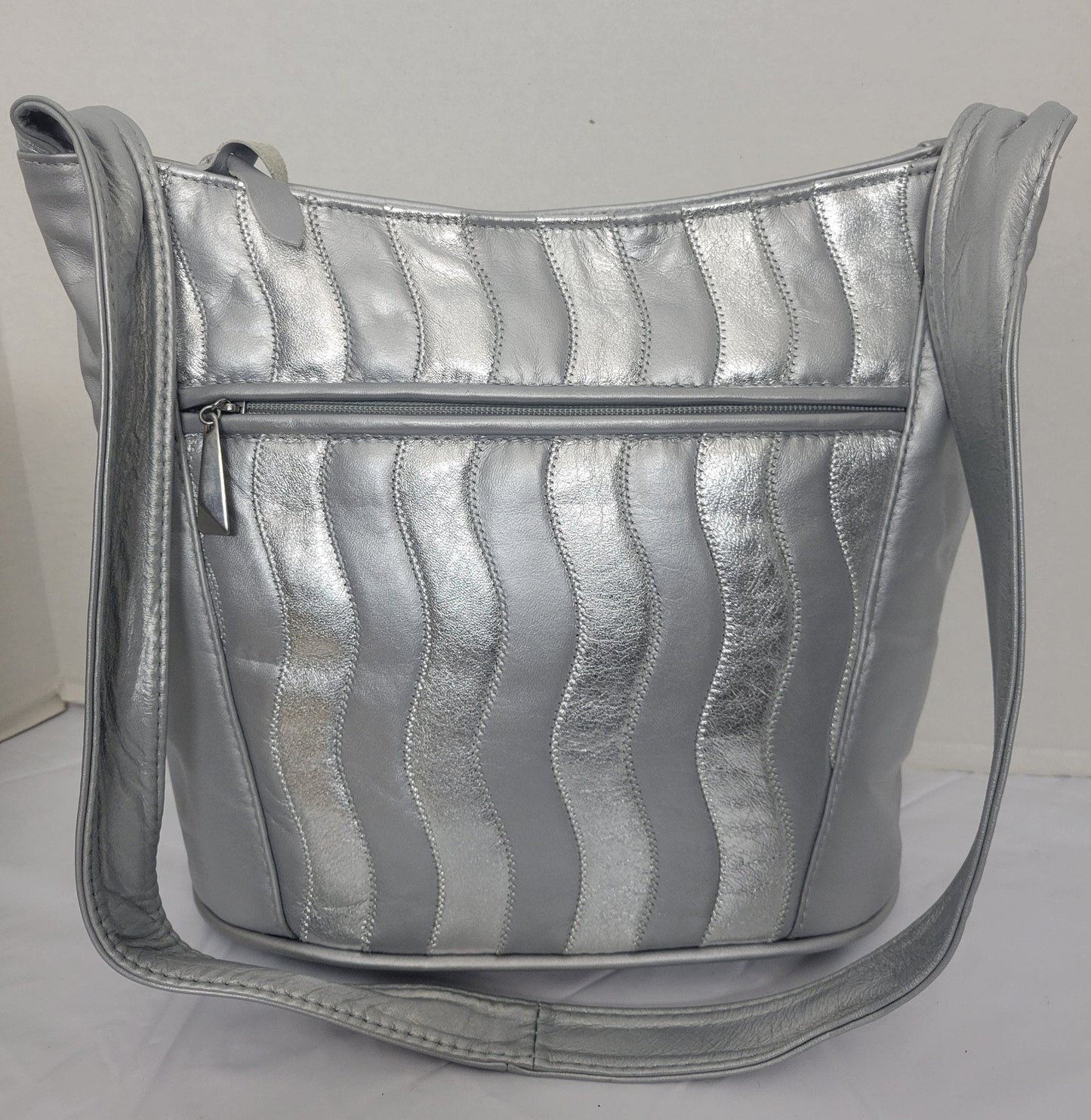 Tejrasila-Silver Grey with silver shining leather handbag!Zigzag designe. 3 outside pockets.Made in USA!