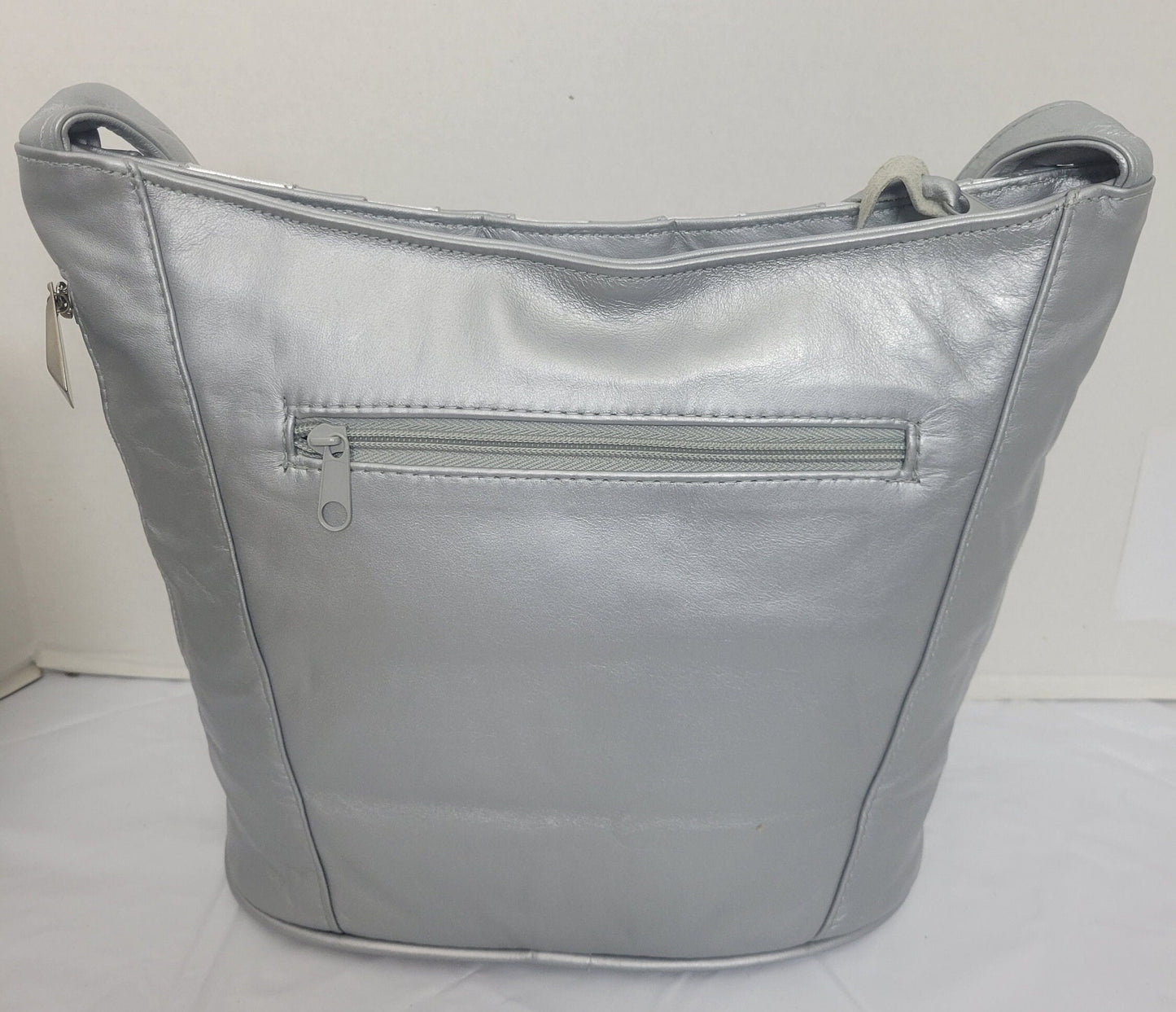 Tejrasila-Silver Grey with silver shining leather handbag!Zigzag designe. 3 outside pockets.Made in USA!