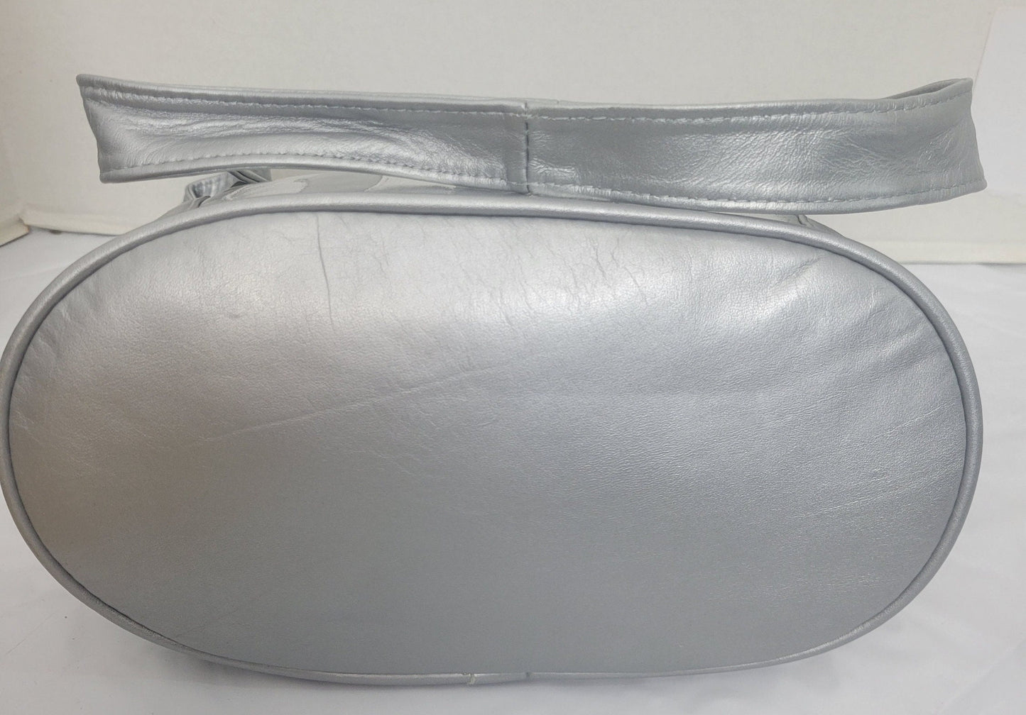 Tejrasila-Silver Grey with silver shining leather handbag!Zigzag designe. 3 outside pockets.Made in USA!