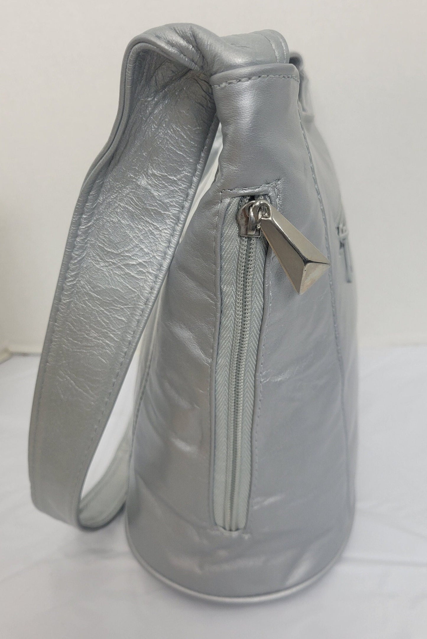 Tejrasila-Silver Grey with silver shining leather handbag!Zigzag designe. 3 outside pockets.Made in USA!