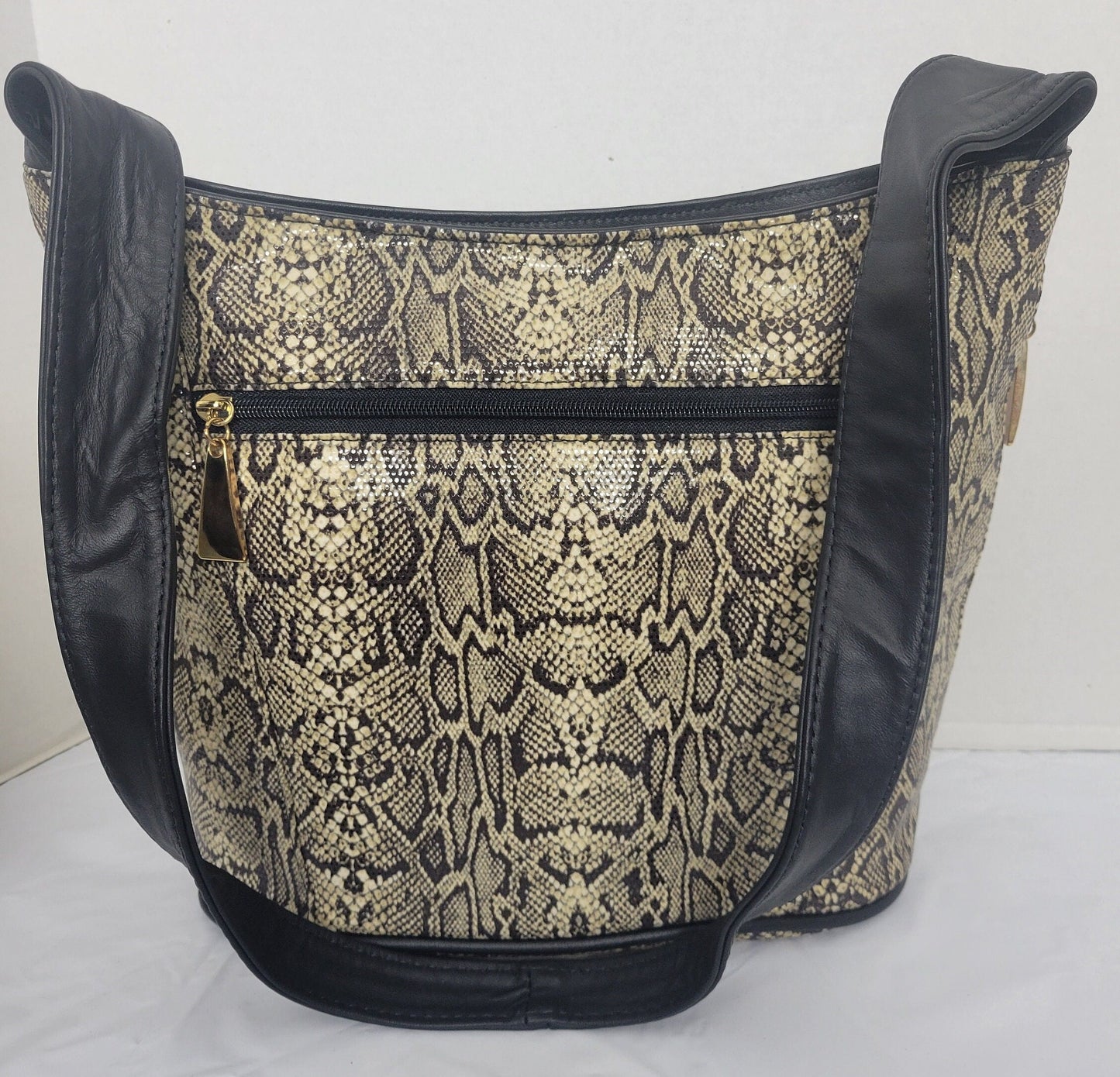 Tejrasila-Black with brown mix snake print fabric with genuine leather Shoulder handbag! Three outside pockets.Made in USA!