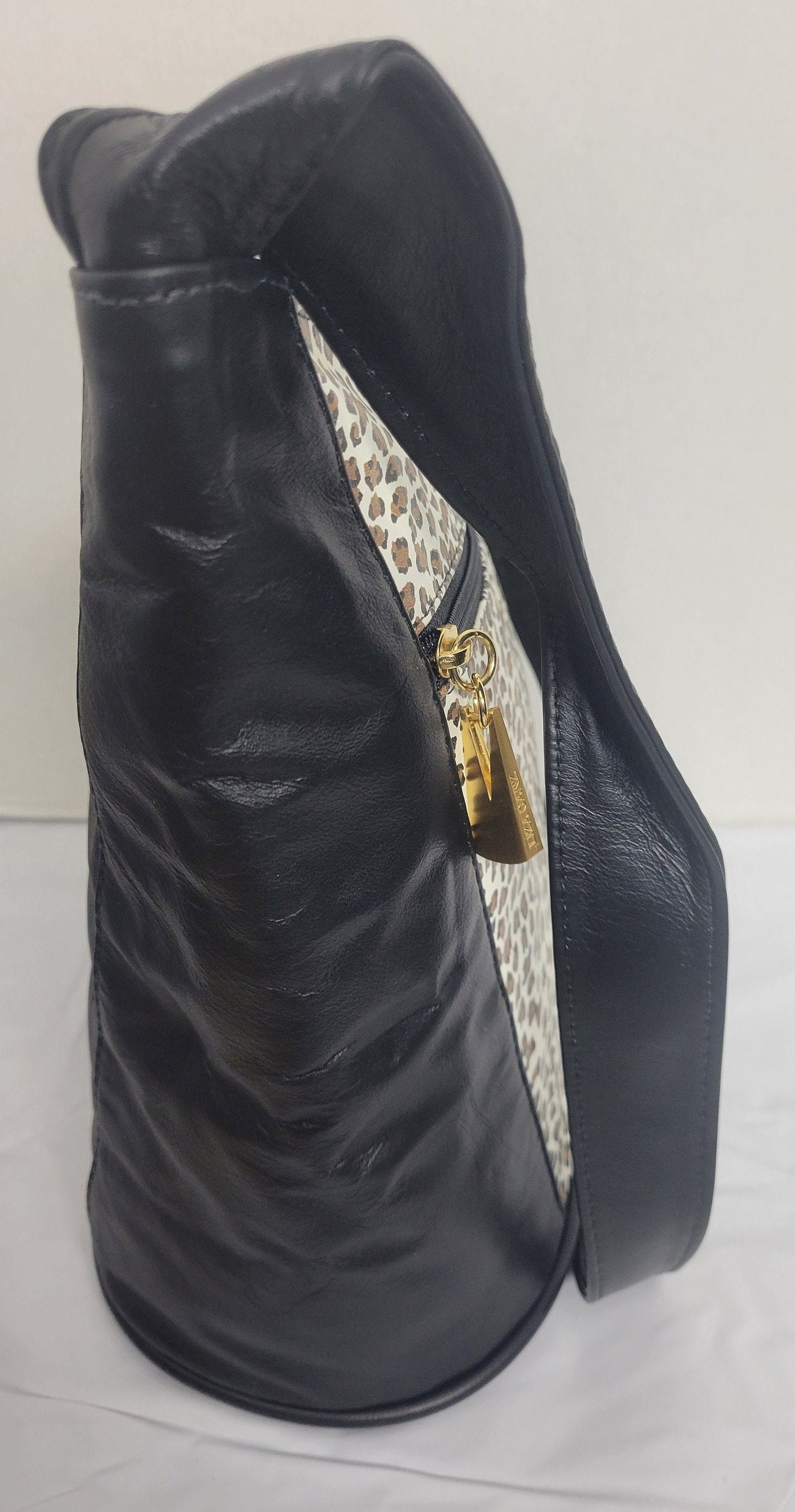 Tejrasila-Black with tiger print genuine leather Shoulder handbag! Three outside pockets.Made in USA!