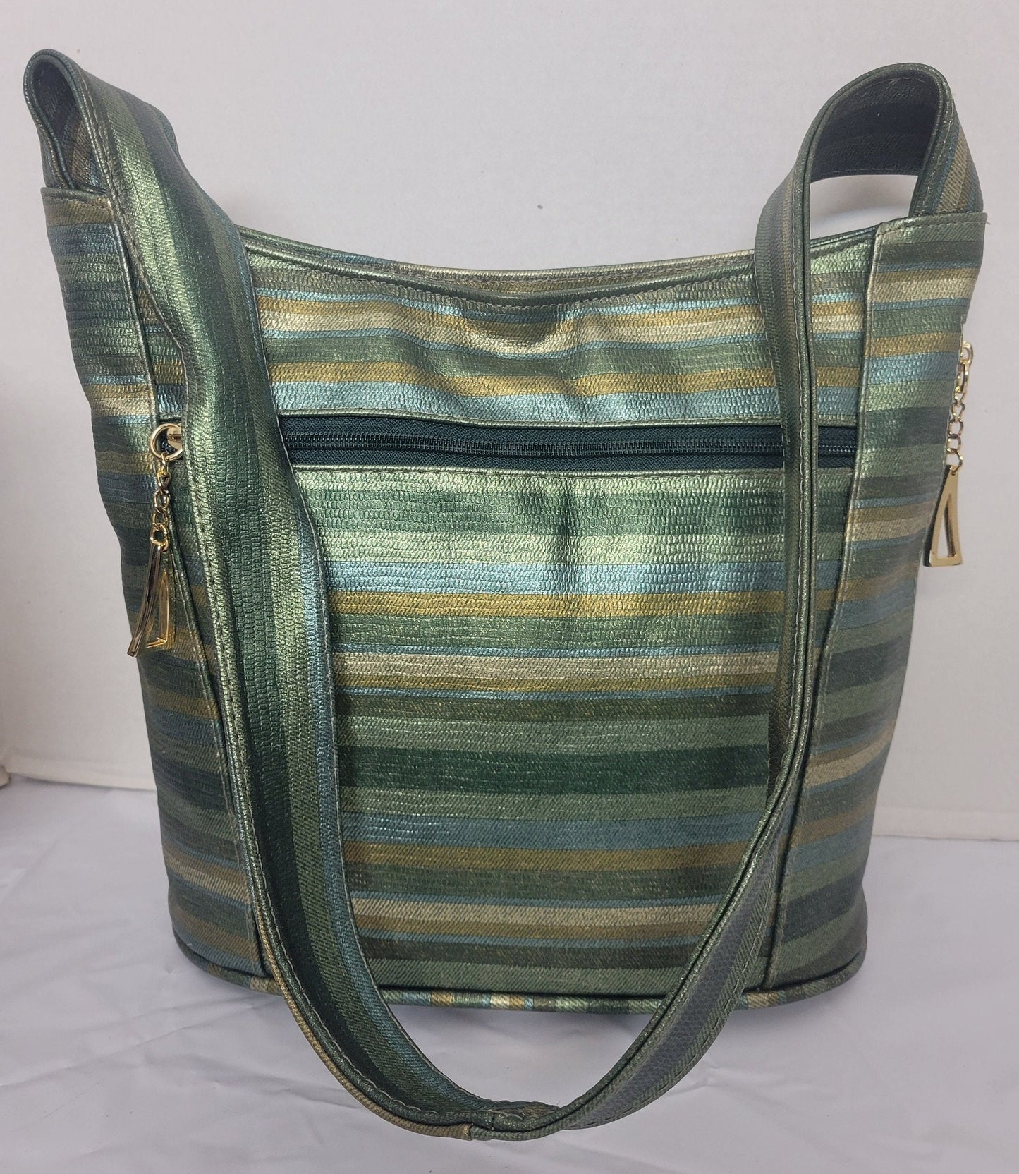 Tejrasila-Green multiprint women's Shoulder handbag! Three outside pockets.Made with genuine leather in USA!