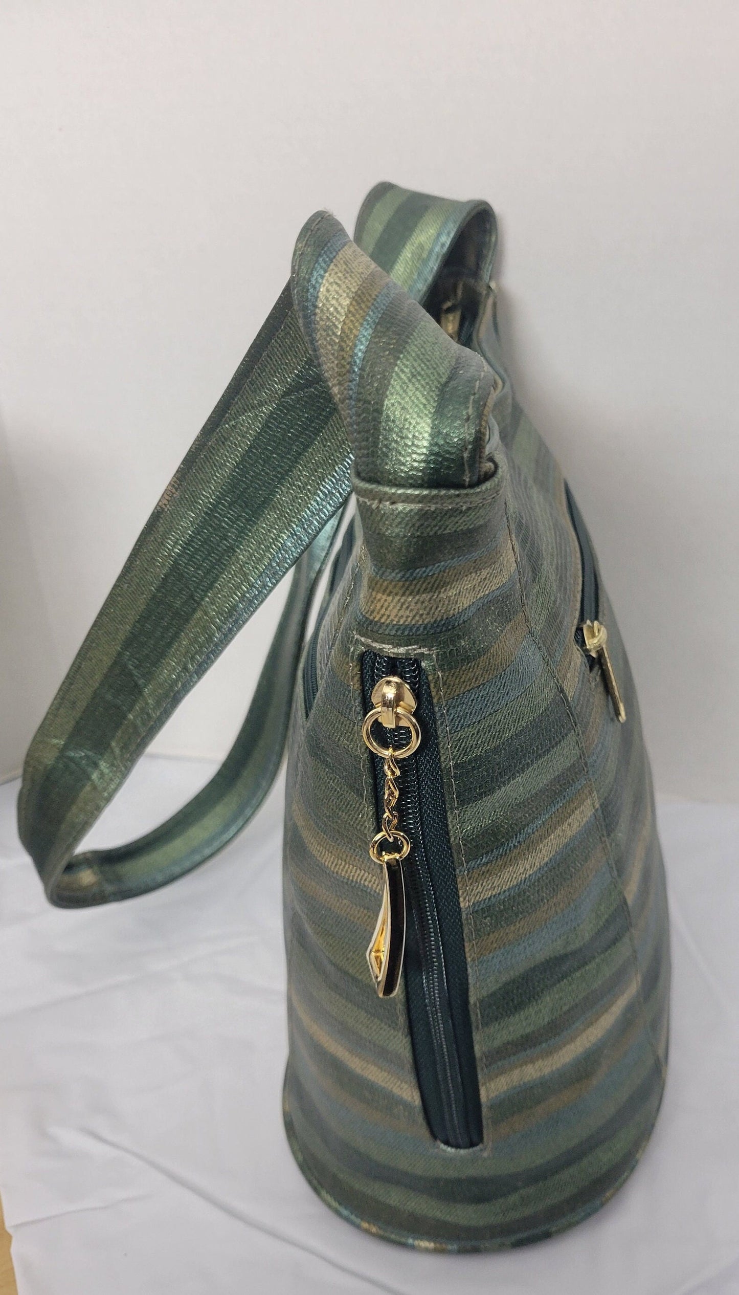 Tejrasila-Green multiprint women's Shoulder handbag! Three outside pockets.Made with genuine leather in USA!