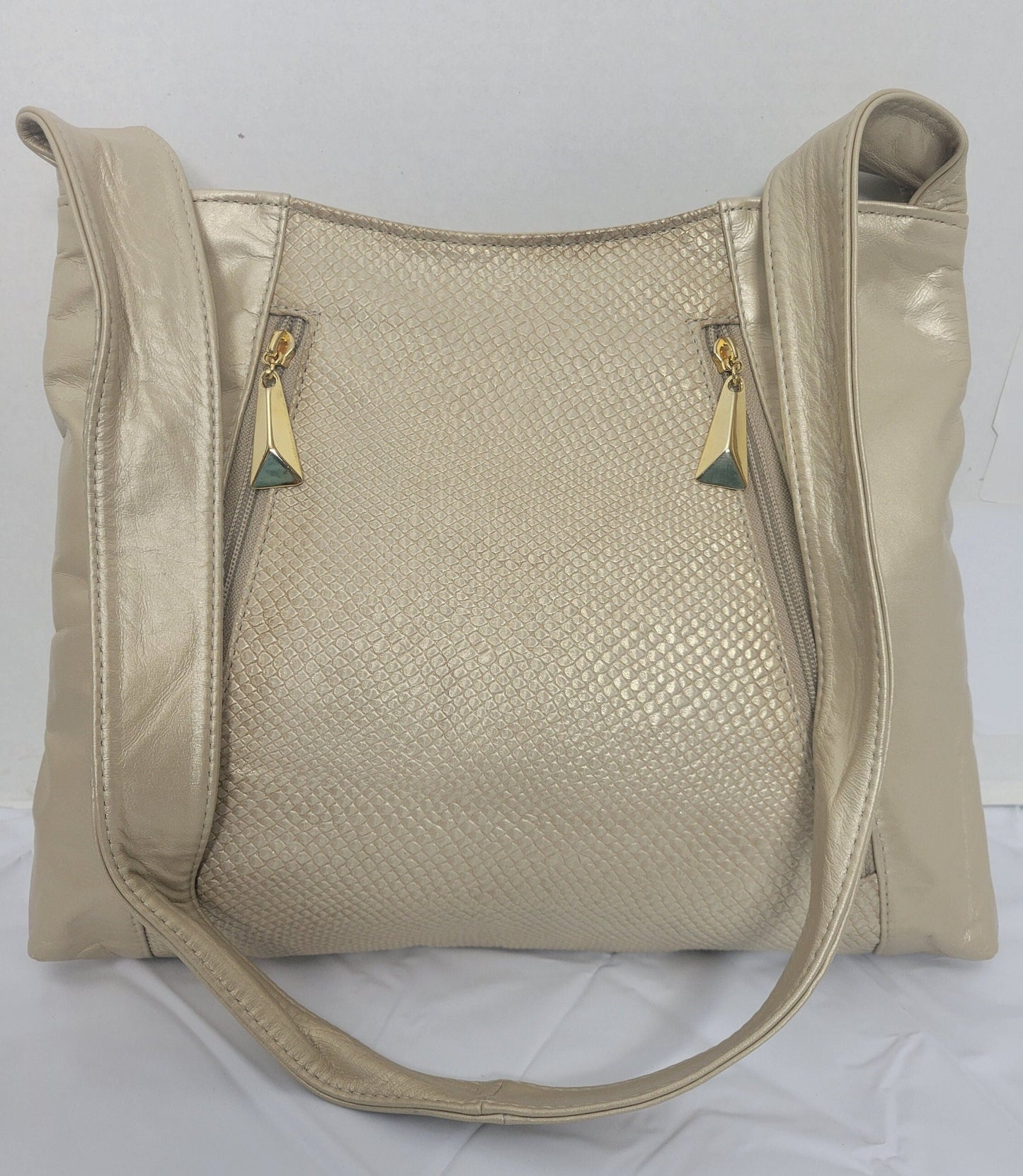 Champagne with Champagne print leather handbag! Two left and right pockets. Made in USA.