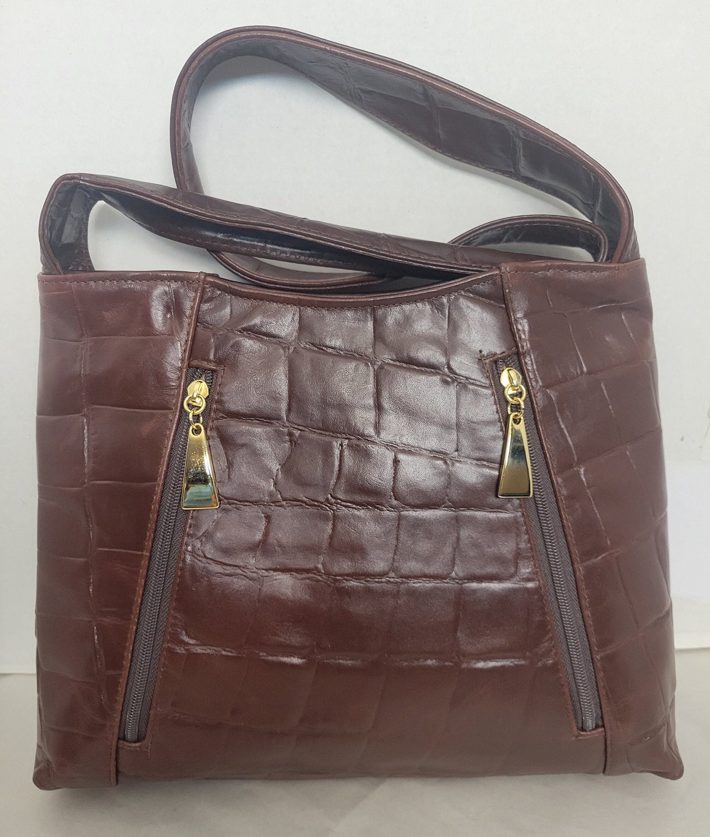 Brown print leather handbag! Two left and right pockets. Made in USA.