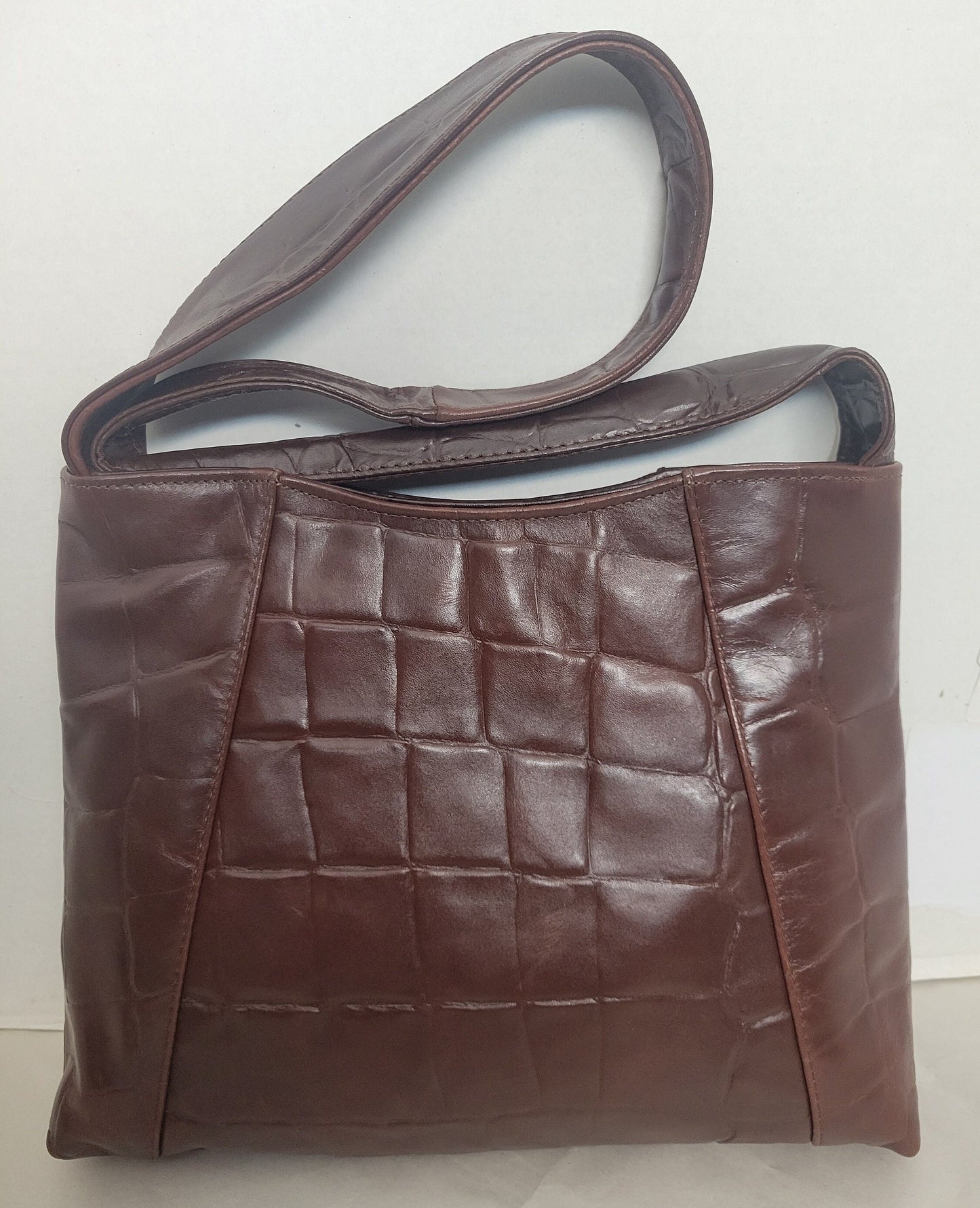 Brown print leather handbag! Two left and right pockets. Made in USA.