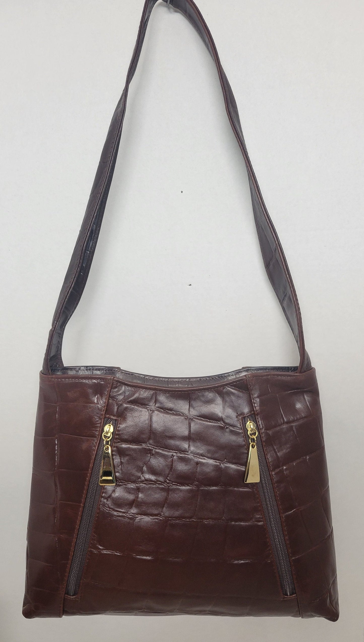 Brown print leather handbag! Two left and right pockets. Made in USA.