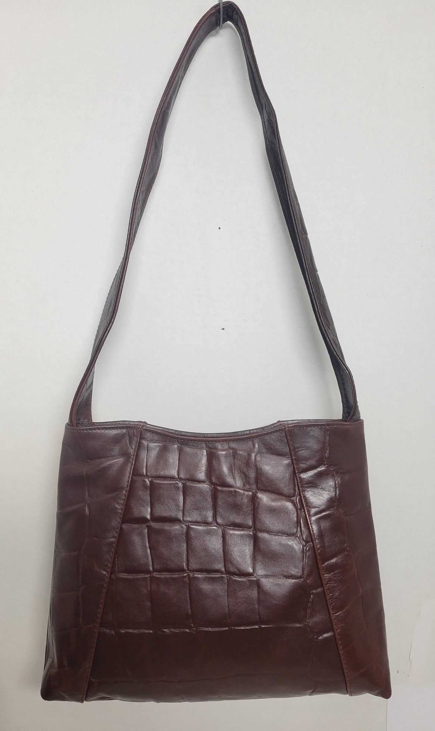 Brown print leather handbag! Two left and right pockets. Made in USA.