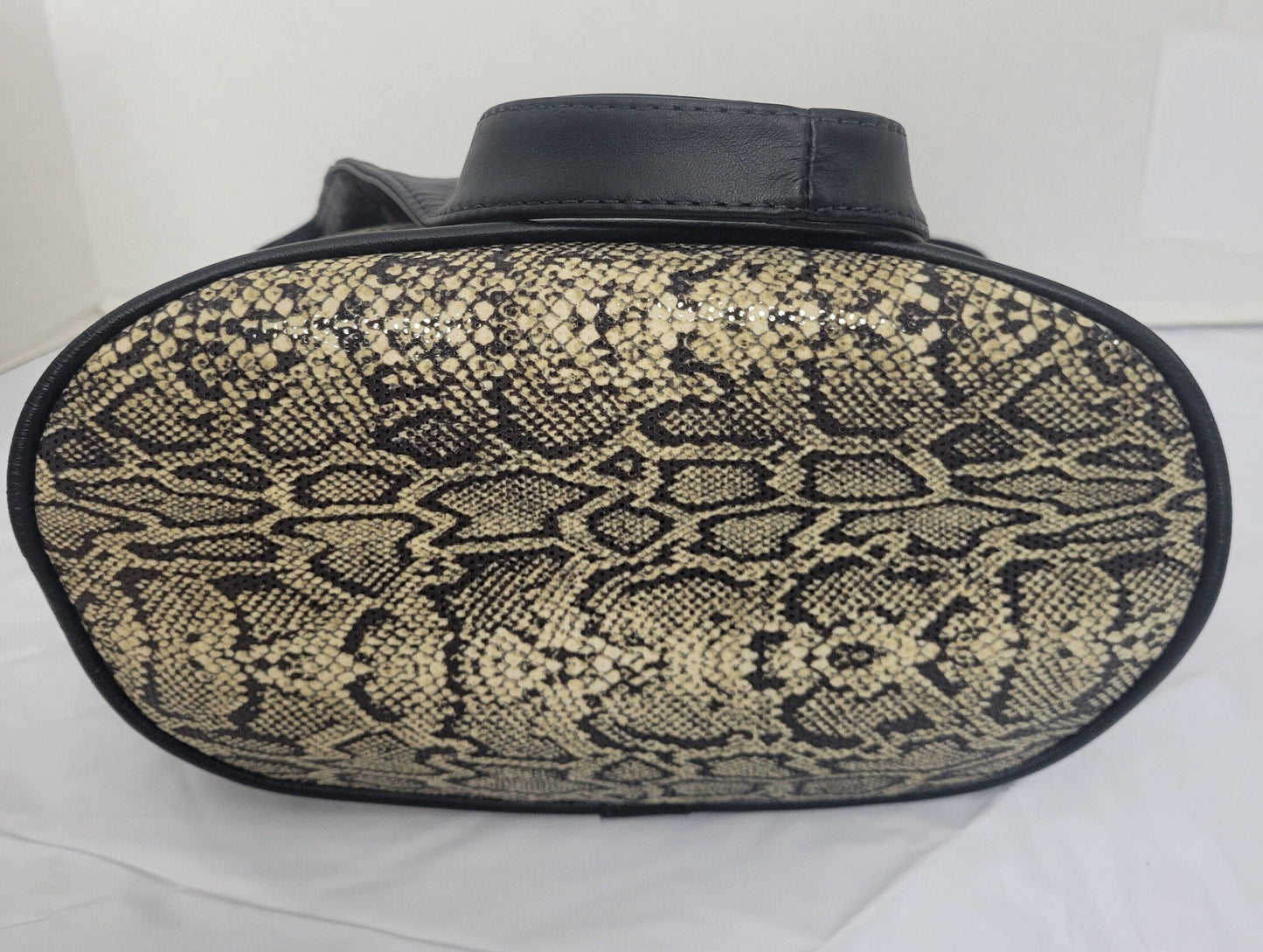 Tejrasila-Black with brown mix snake print fabric with genuine leather Shoulder handbag! Three outside pockets.Made in USA!