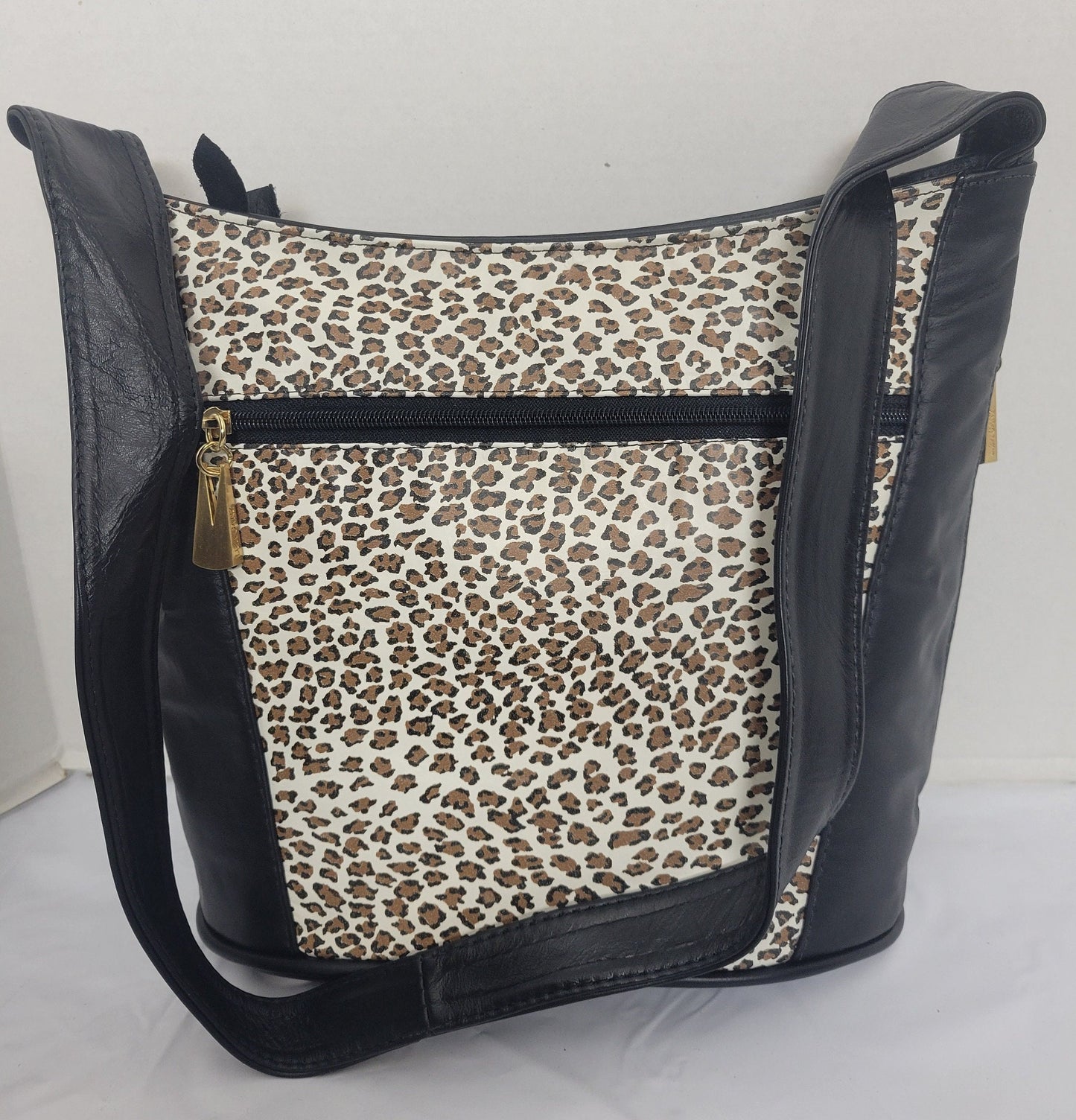 Tejrasila-Black with tiger print genuine leather Shoulder handbag! Three outside pockets.Made in USA!