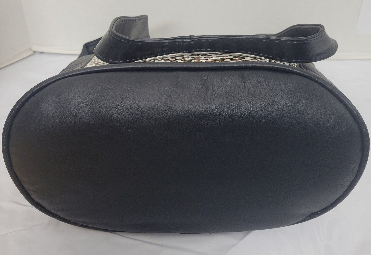 Tejrasila-Black with tiger print genuine leather Shoulder handbag! Three outside pockets.Made in USA!