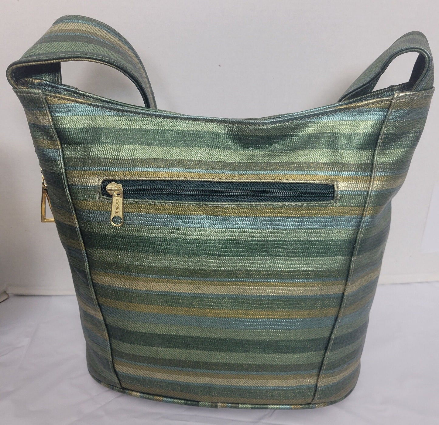 Tejrasila-Green multiprint women's Shoulder handbag! Three outside pockets.Made with genuine leather in USA!