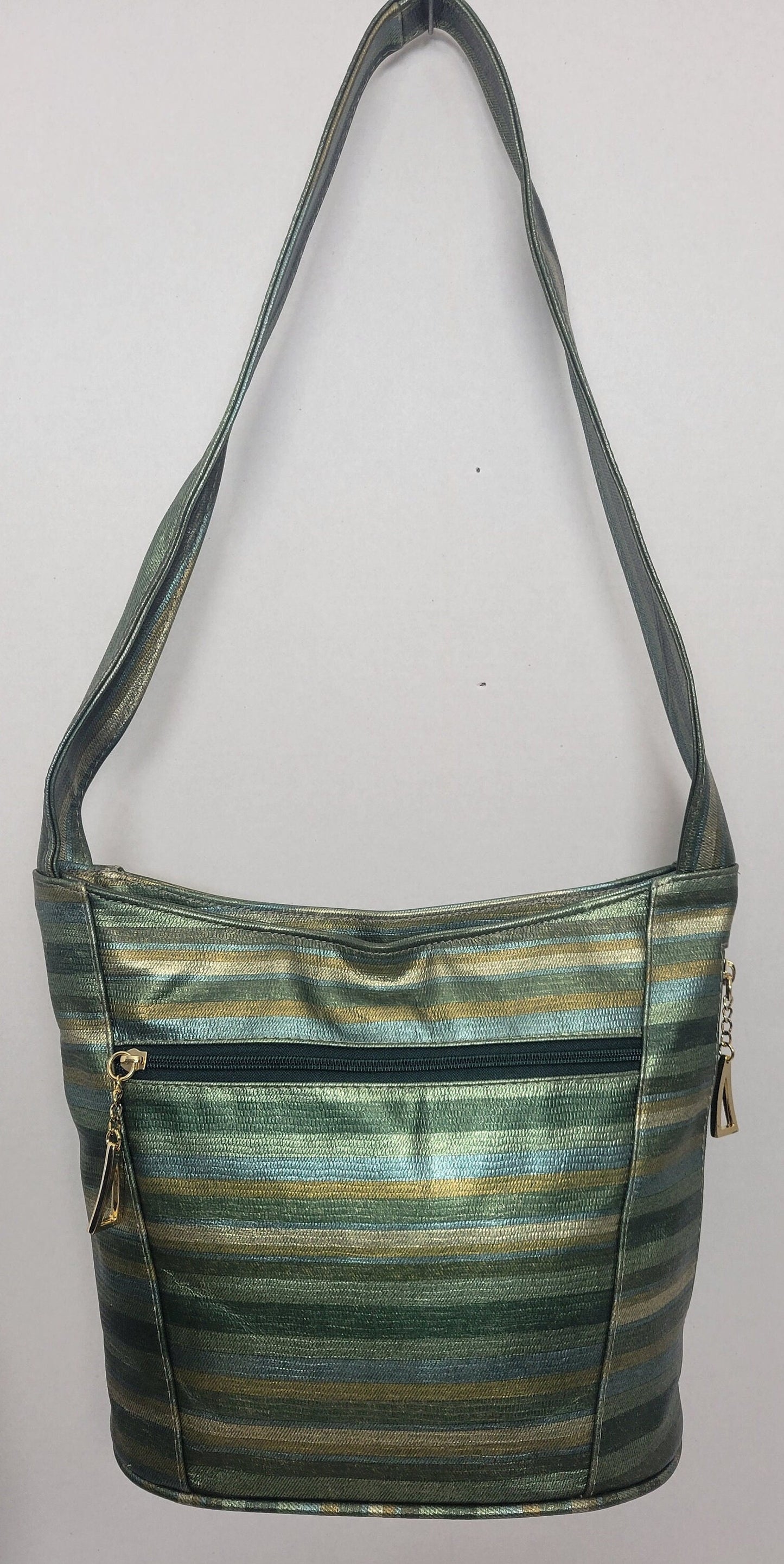 Tejrasila-Green multiprint women's Shoulder handbag! Three outside pockets.Made with genuine leather in USA!