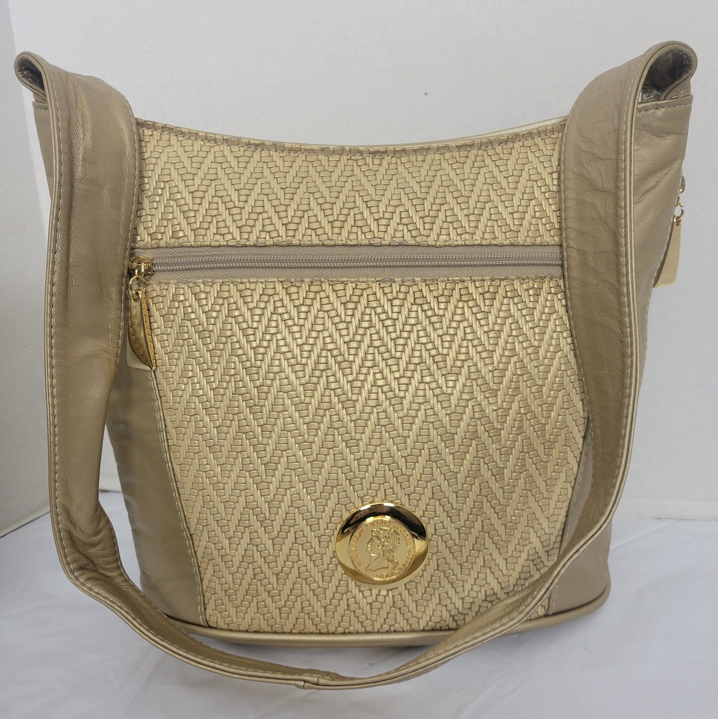 Tejrasila-Gold mate with gold print genuine leather, gold matel coin design Shoulder handbag! Three outside pockets.Made in USA!