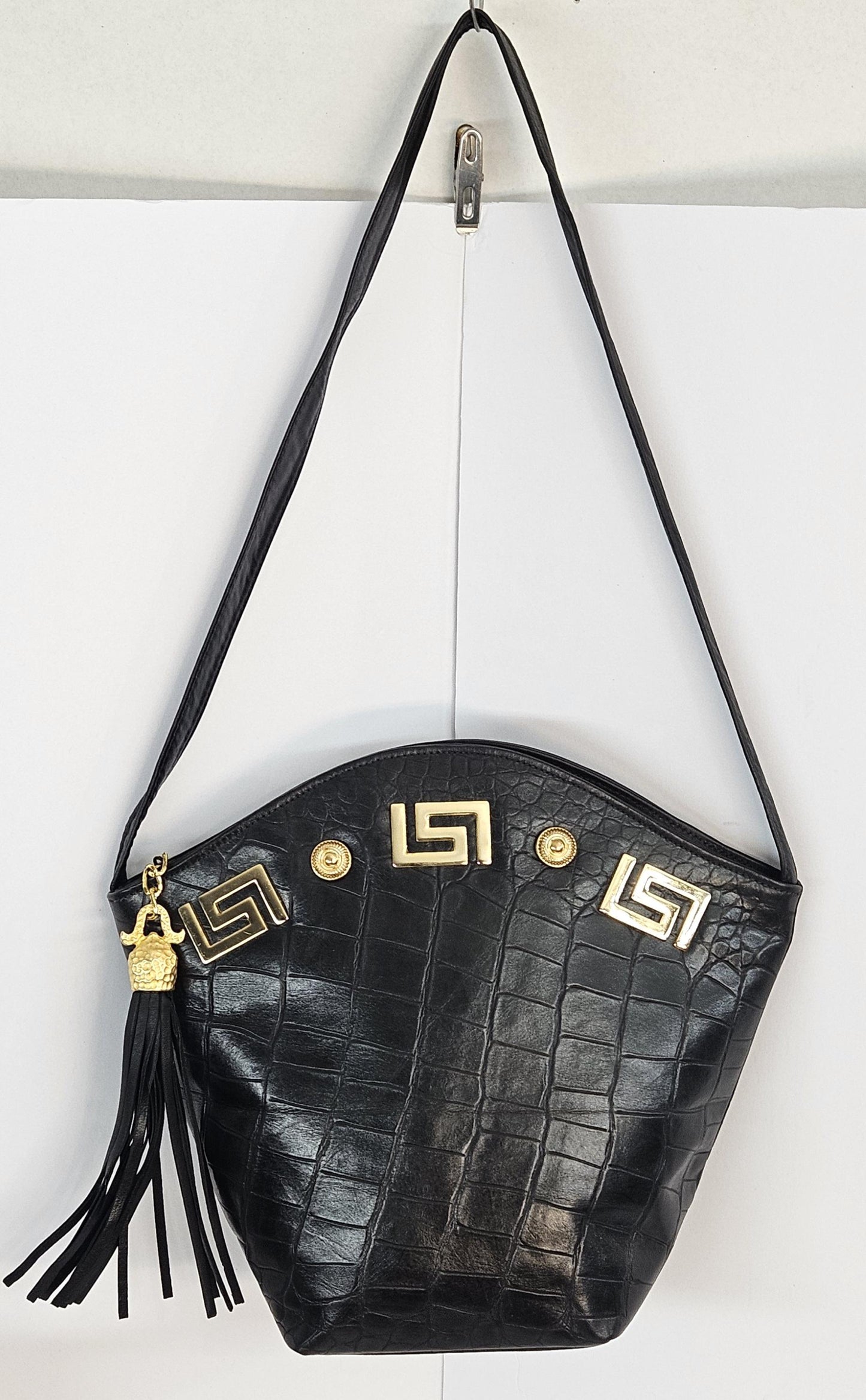 Black Leather Handbag: Embossed Print, Gold Accents & Tassel