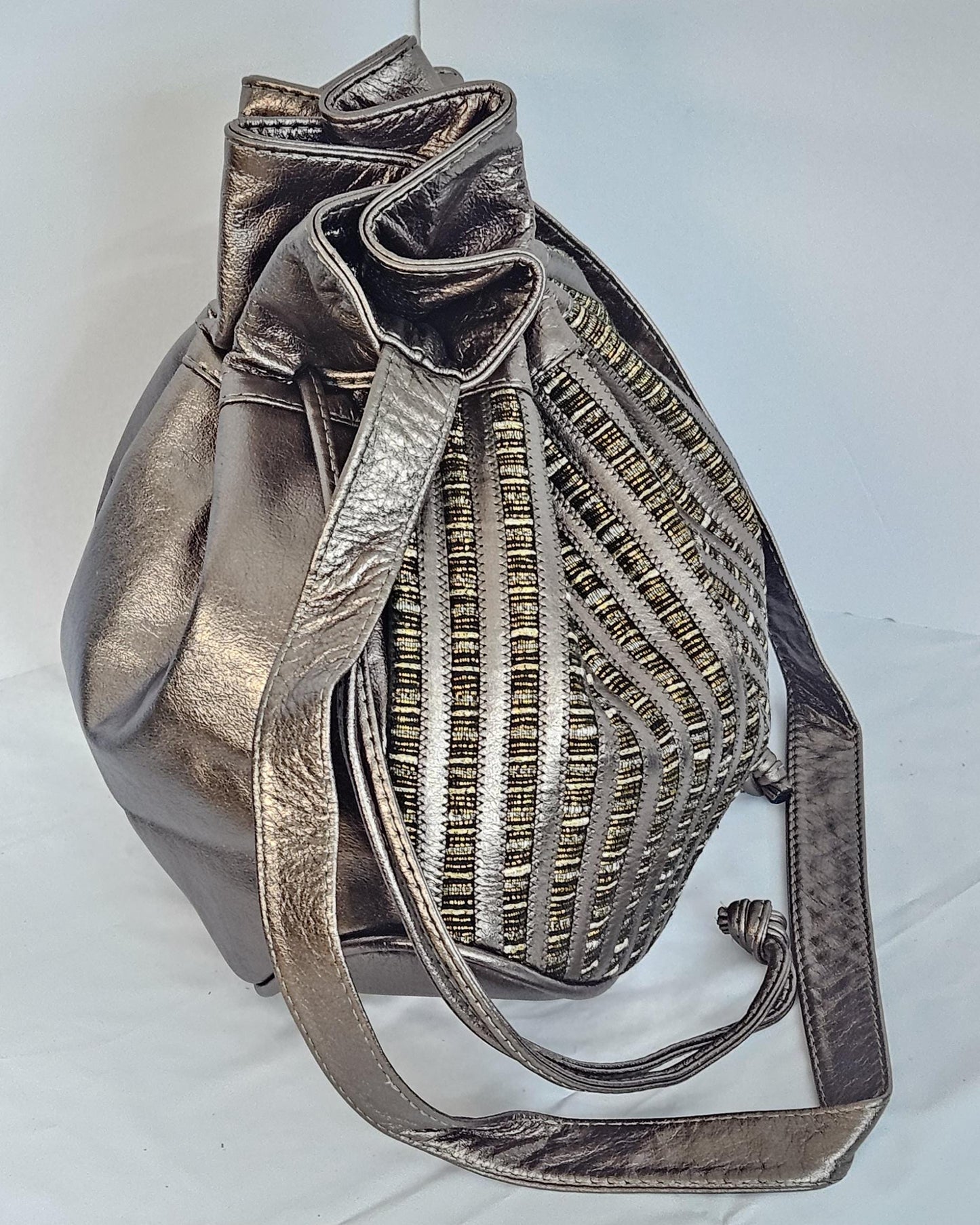 Pewter shinning Genuine Leather with  fabric zigzags stripes design. Item TR2031Ps-zig.Close with Drowsting Shoulders.Made in USA.