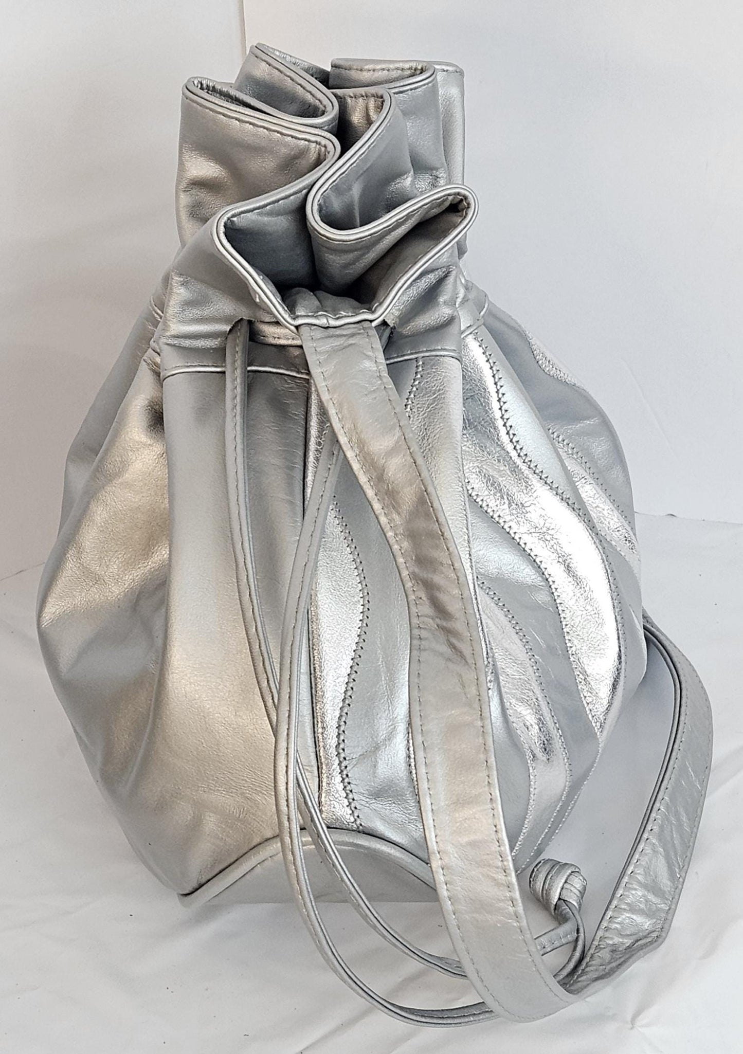 Grey with shinning Silver Genuine Leather Zigzag design. ItemTR2031Gss.Close with Drowsting Shoulders.Made in USA.