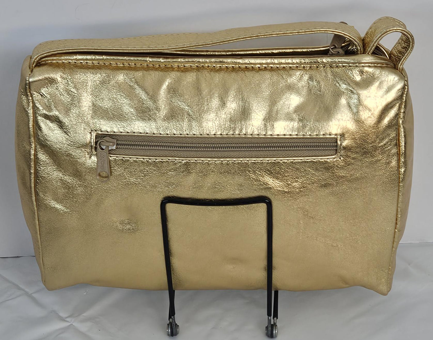 Gold,Silver,and pewter metallic design with gold matel Z&buttons. Genuine Leather Handbag #TR3018GSP-gzb.Made in USA.