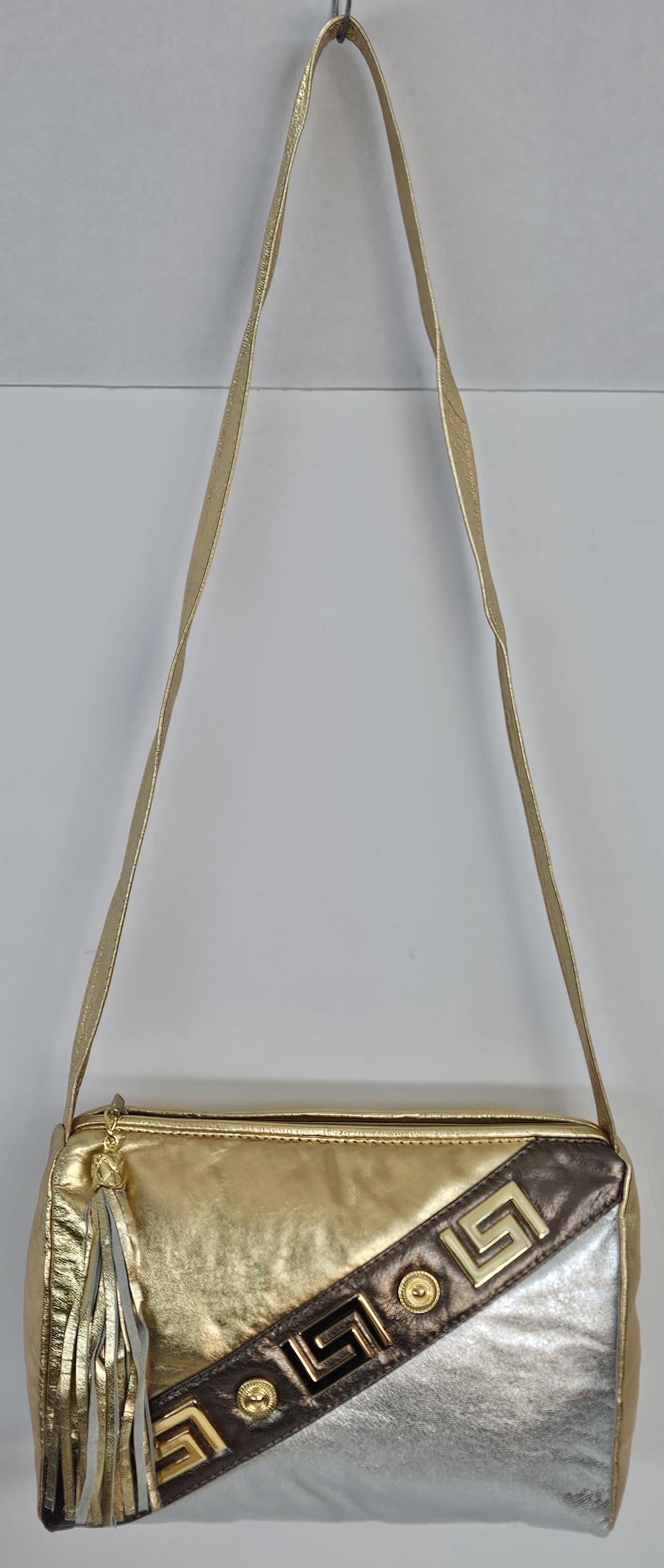 Gold,Silver,and pewter metallic design with gold matel Z&buttons. Genuine Leather Handbag #TR3018GSP-gzb.Made in USA.