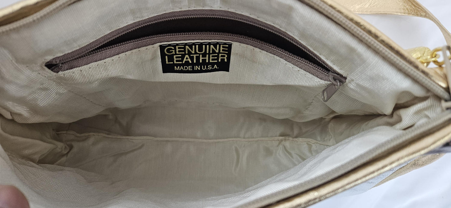 Gold,Silver,and pewter metallic design with gold matel Z&buttons. Genuine Leather Handbag #TR3018GSP-gzb.Made in USA.